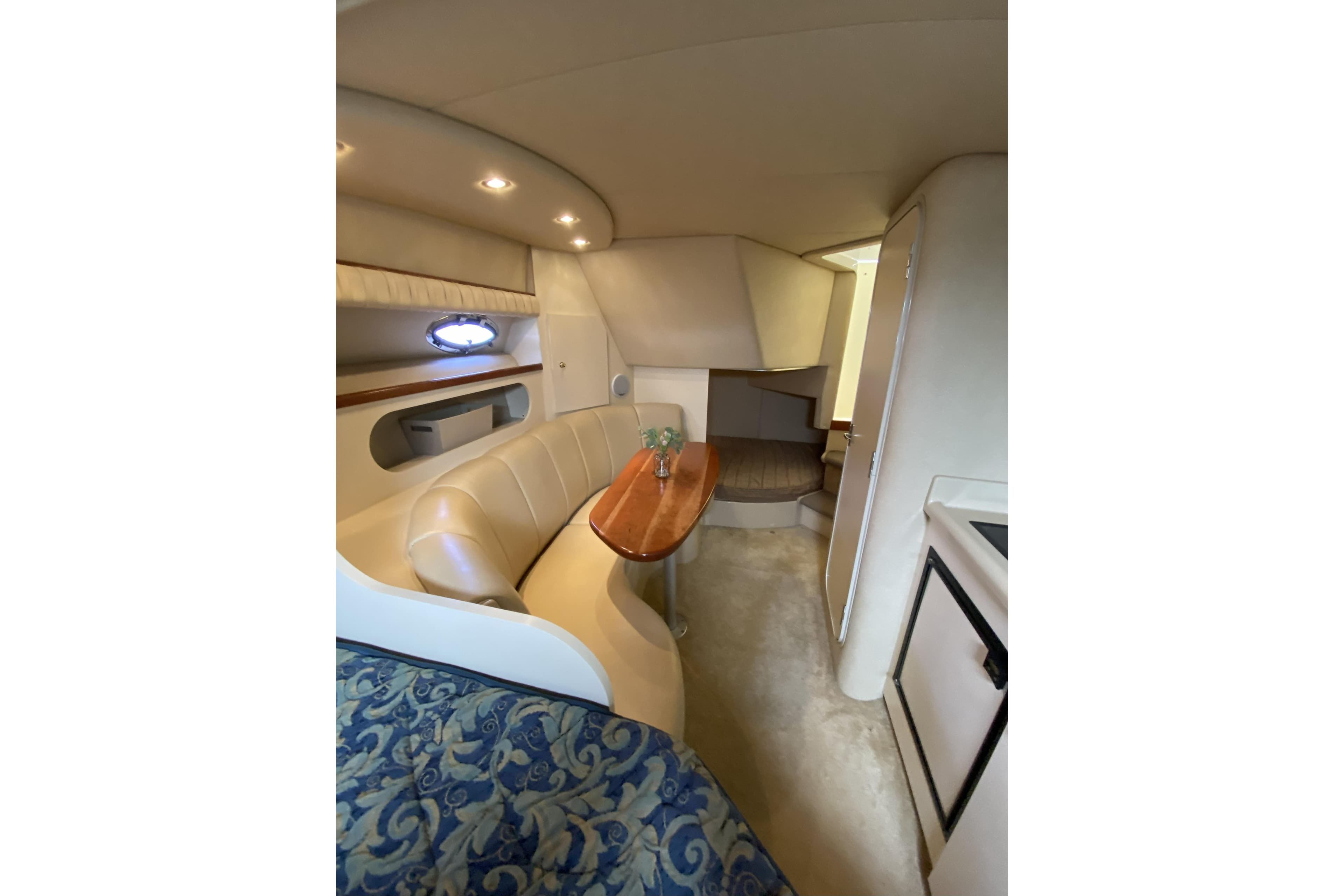 Interior of 2003 Cruisers Yachts 2870 Express with cozy seating and elegant design.