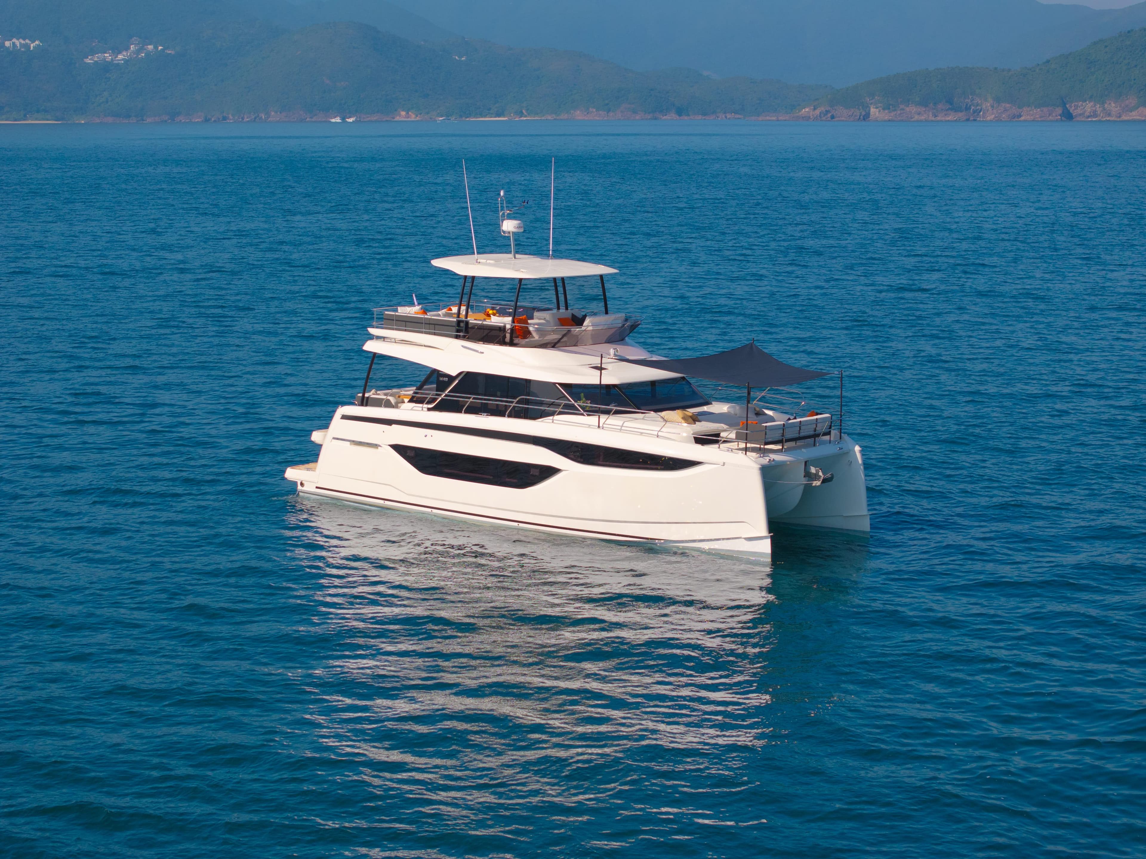Luxury Prestige M48 yacht cruising on serene blue waters, 2025 model.