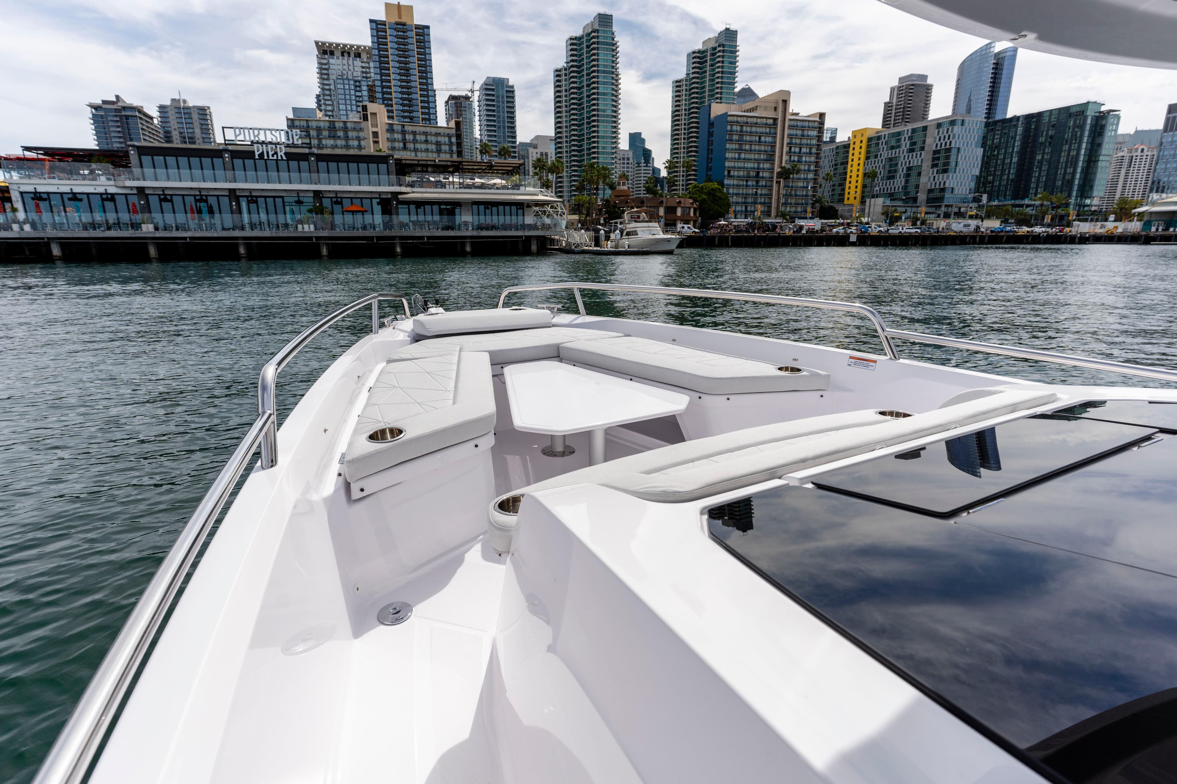2026 Axopar 29 XC Cross Cabin boat with city skyline in the background.