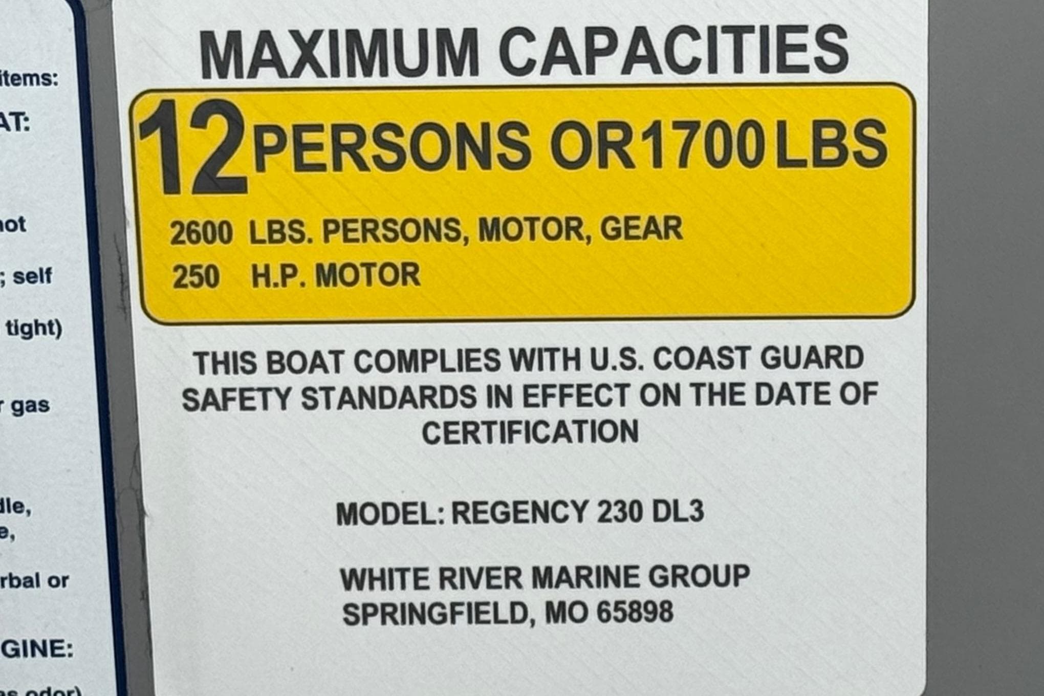 2024 Regency 230 DL3 capacity label: 12 persons or 1700 lbs, 250 HP motor.