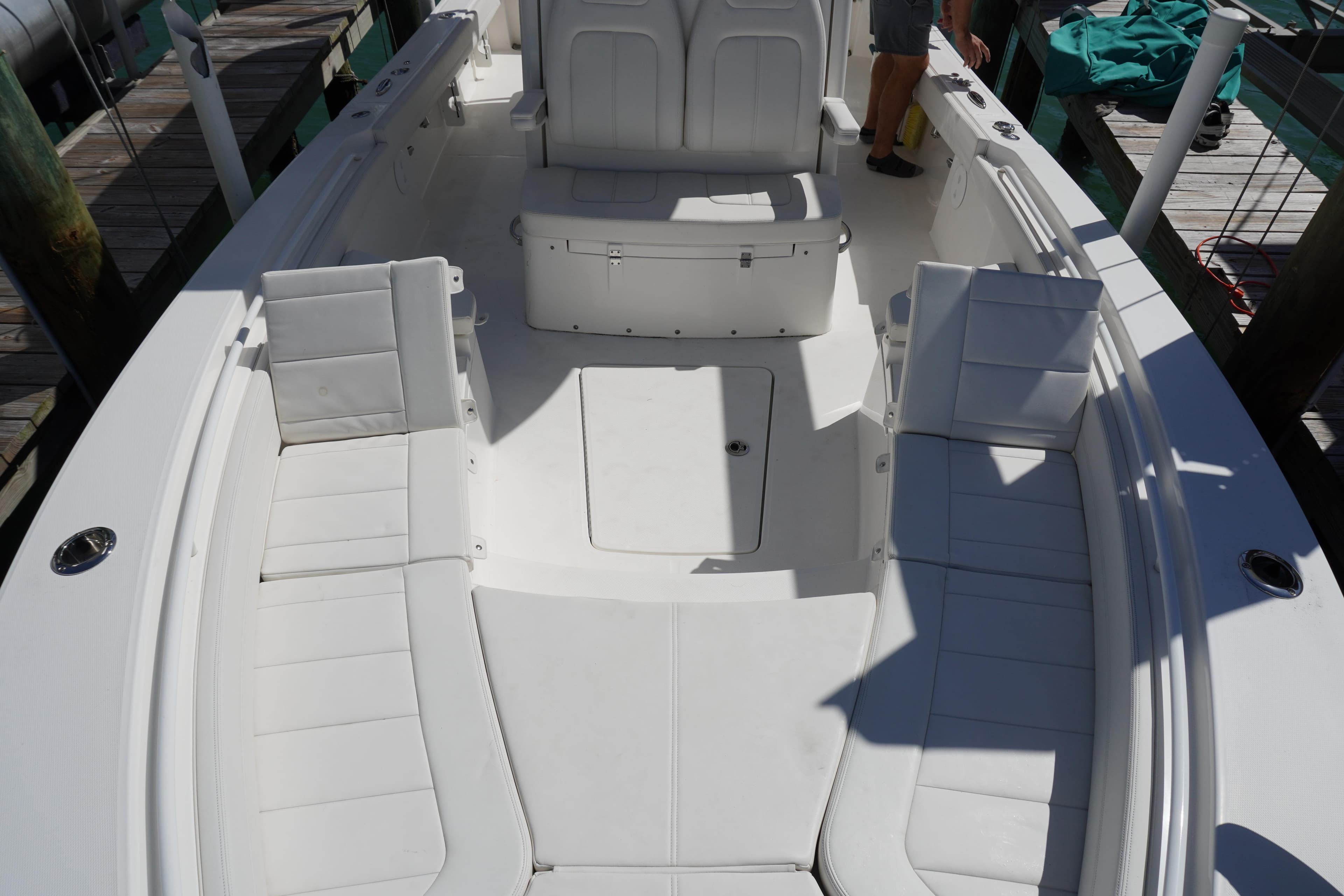 2024 Regulator 26XO boat interior with white seating and spacious deck layout.