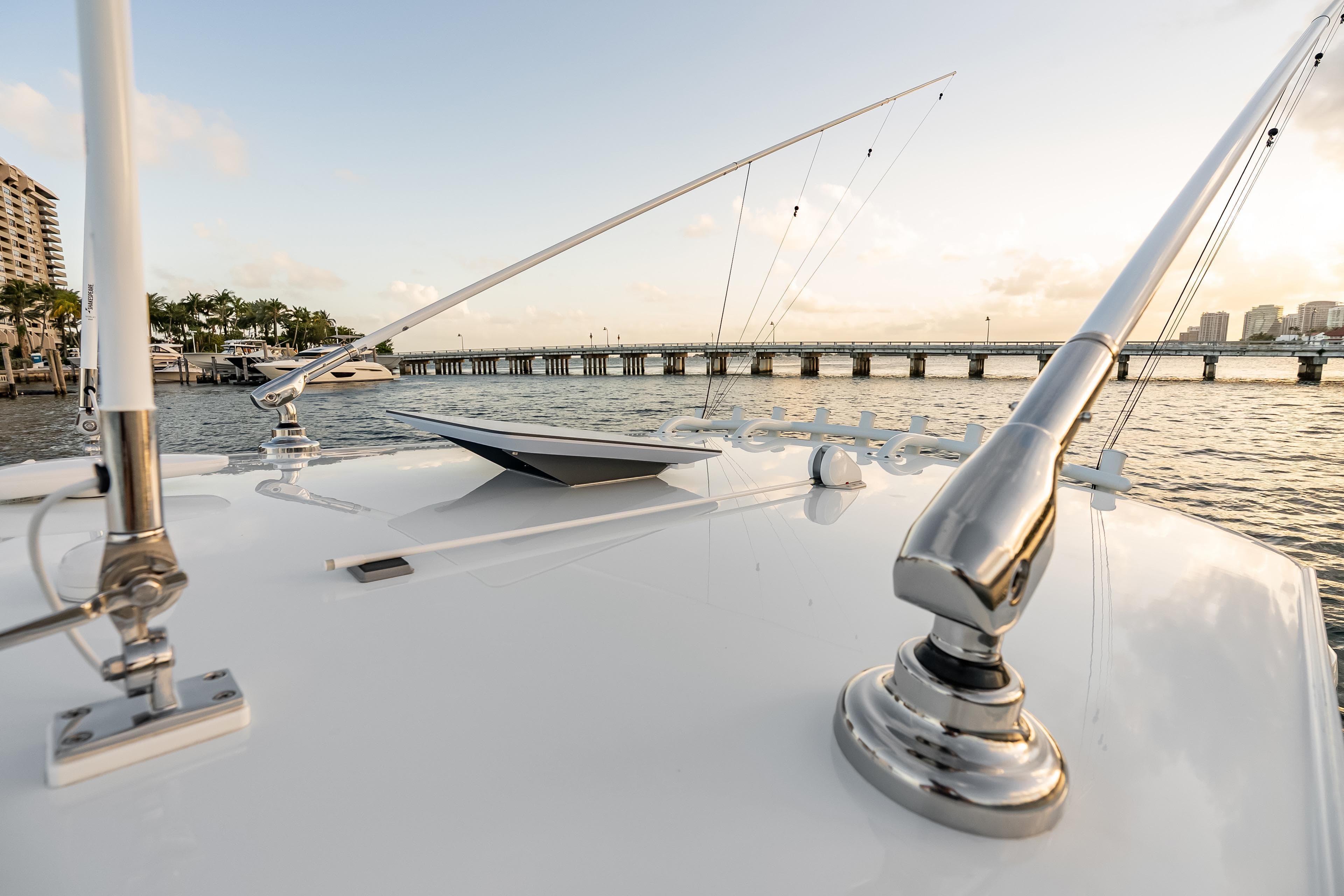 Rooftop view of Freeman 38 boat, 2026 model, with fishing rods and scenic waterfront.