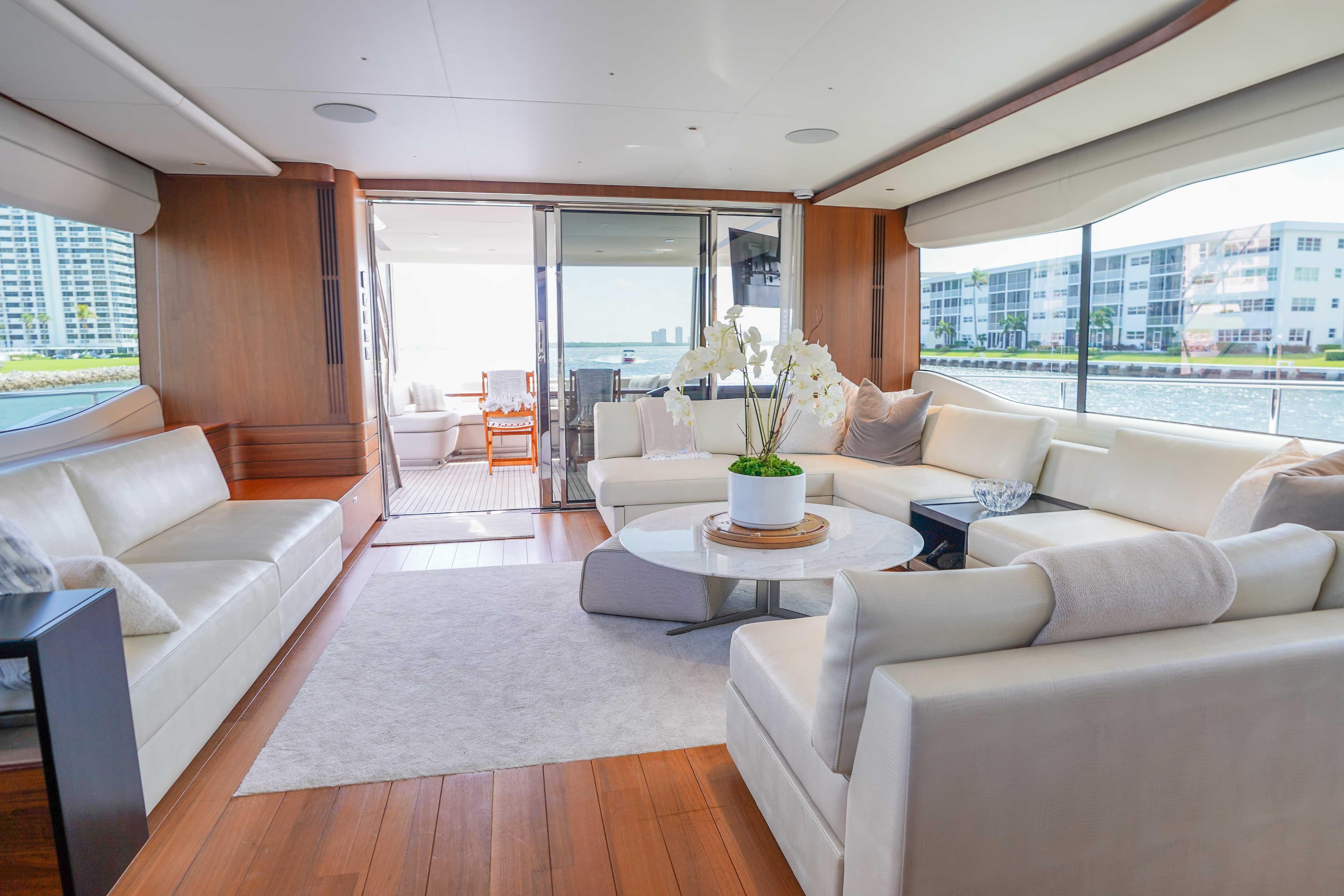 Luxurious interior of 2021 Princess Y85 yacht with elegant seating and panoramic windows.