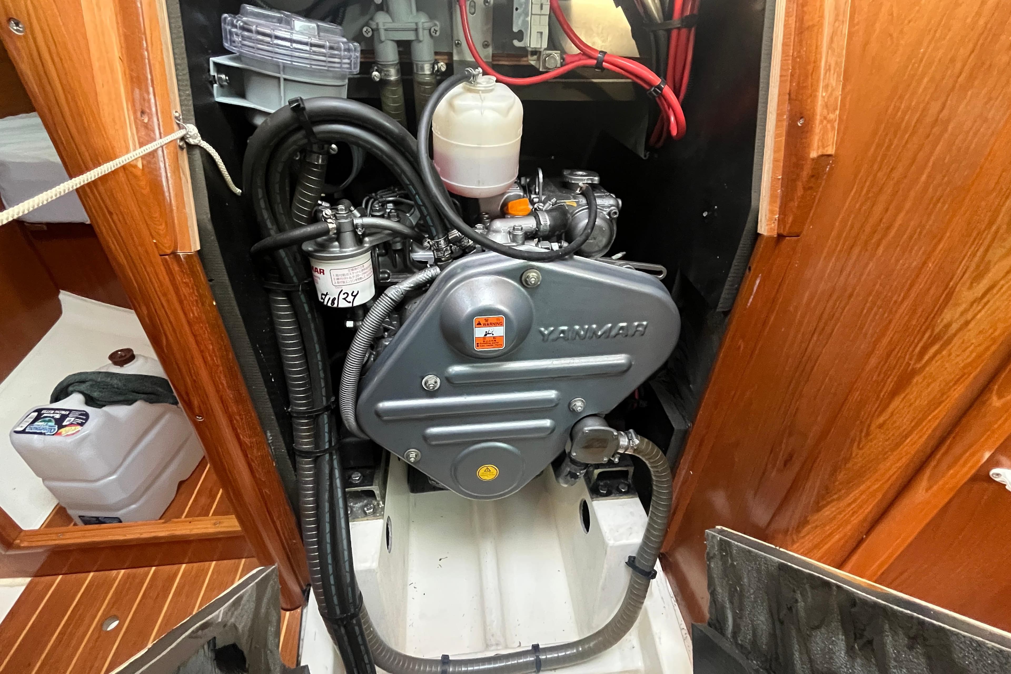 Engine compartment of a 2005 Jeanneau Sun Odyssey 40.3 sailboat with Yanmar engine.
