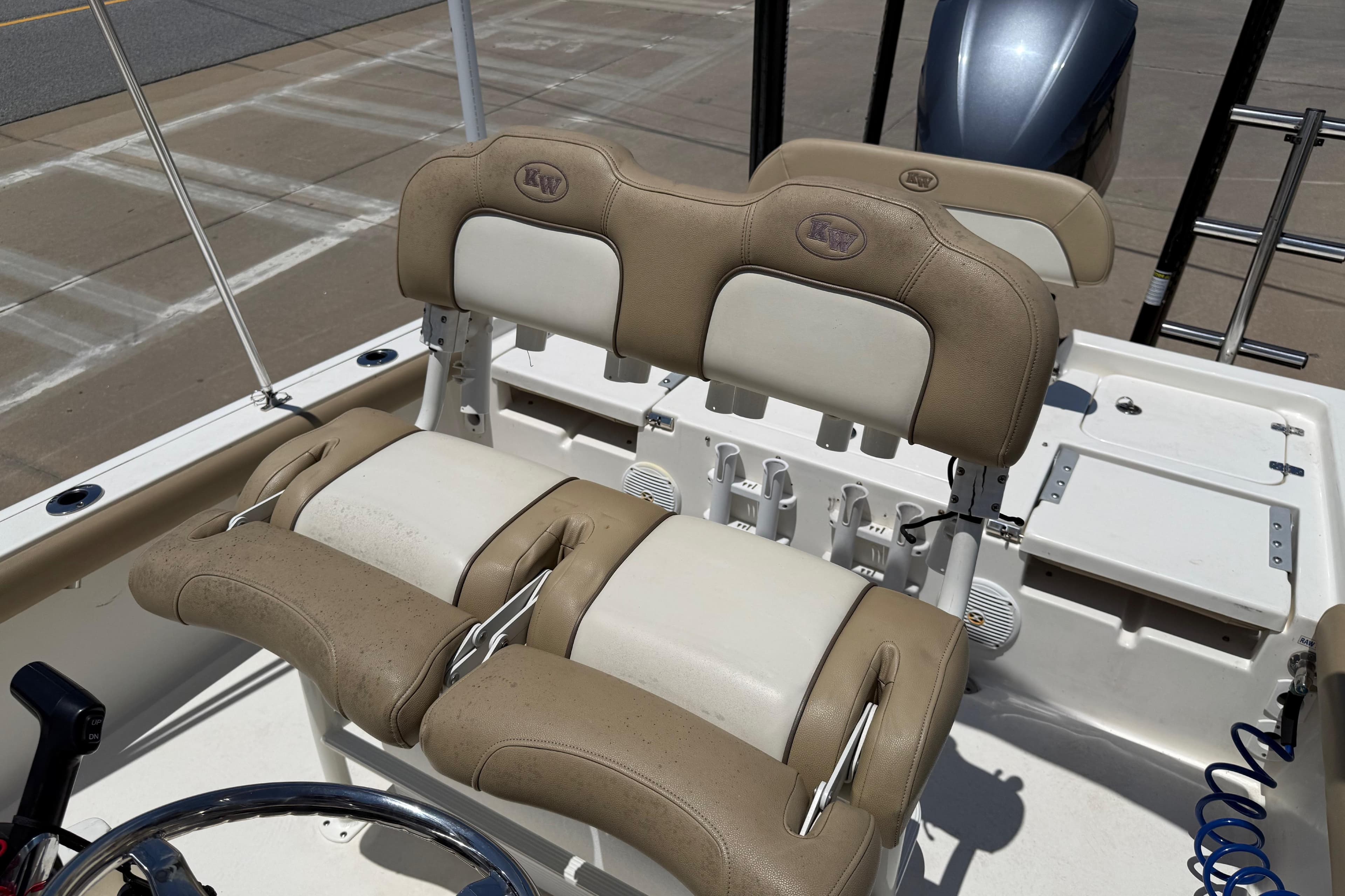 2019 Key West 230 Bay Reef boat seats with beige and white upholstery.