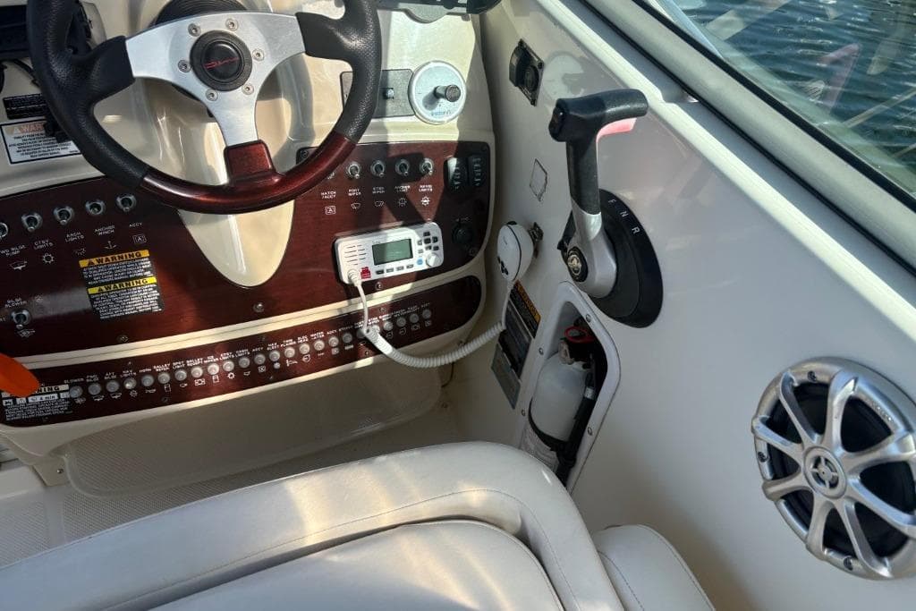 2008 Maxum 2700 SE boat cockpit with steering wheel and control panel.