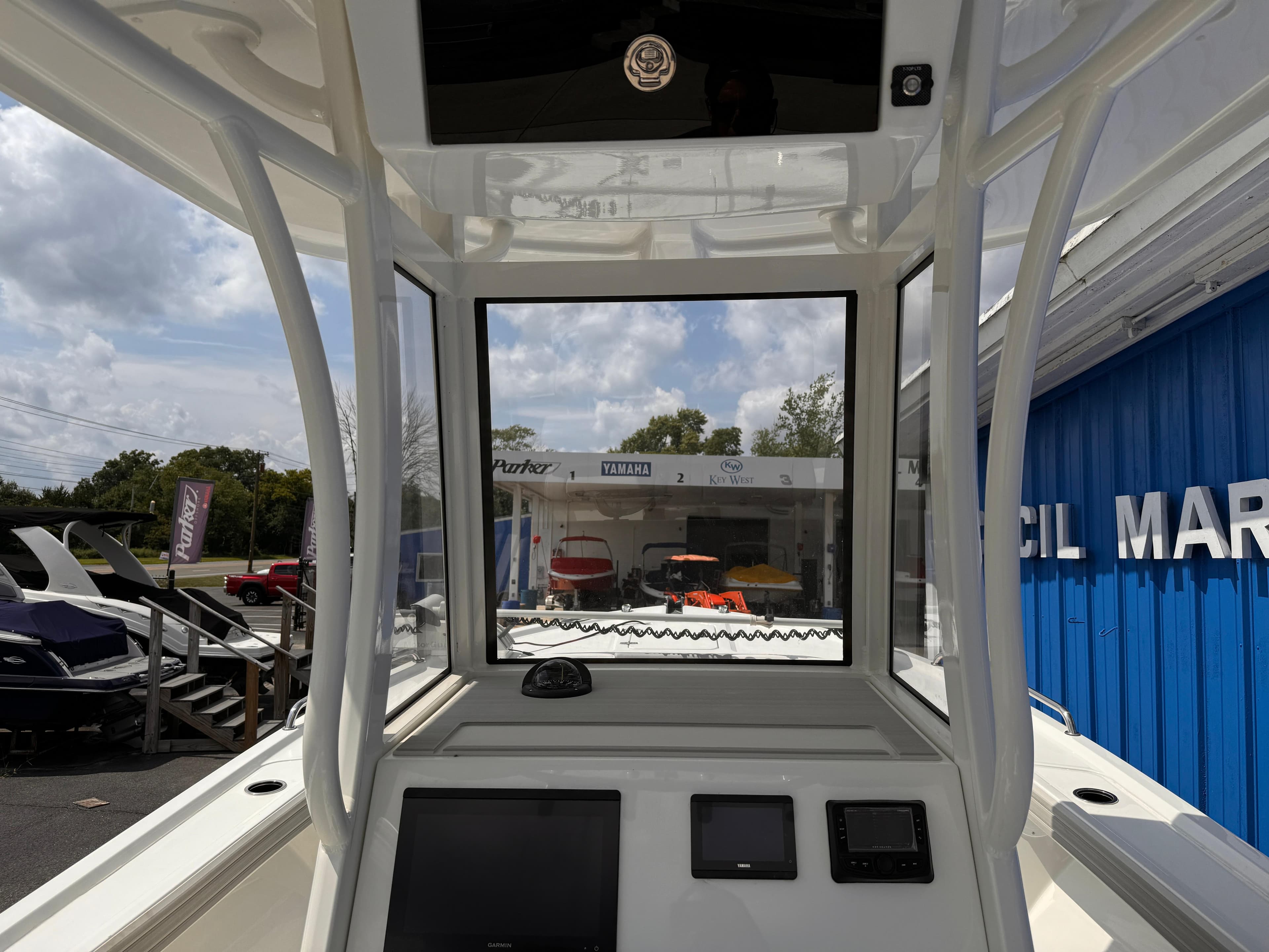 2025 Parker 2200 Center Console boat interior with navigation equipment and marina view.