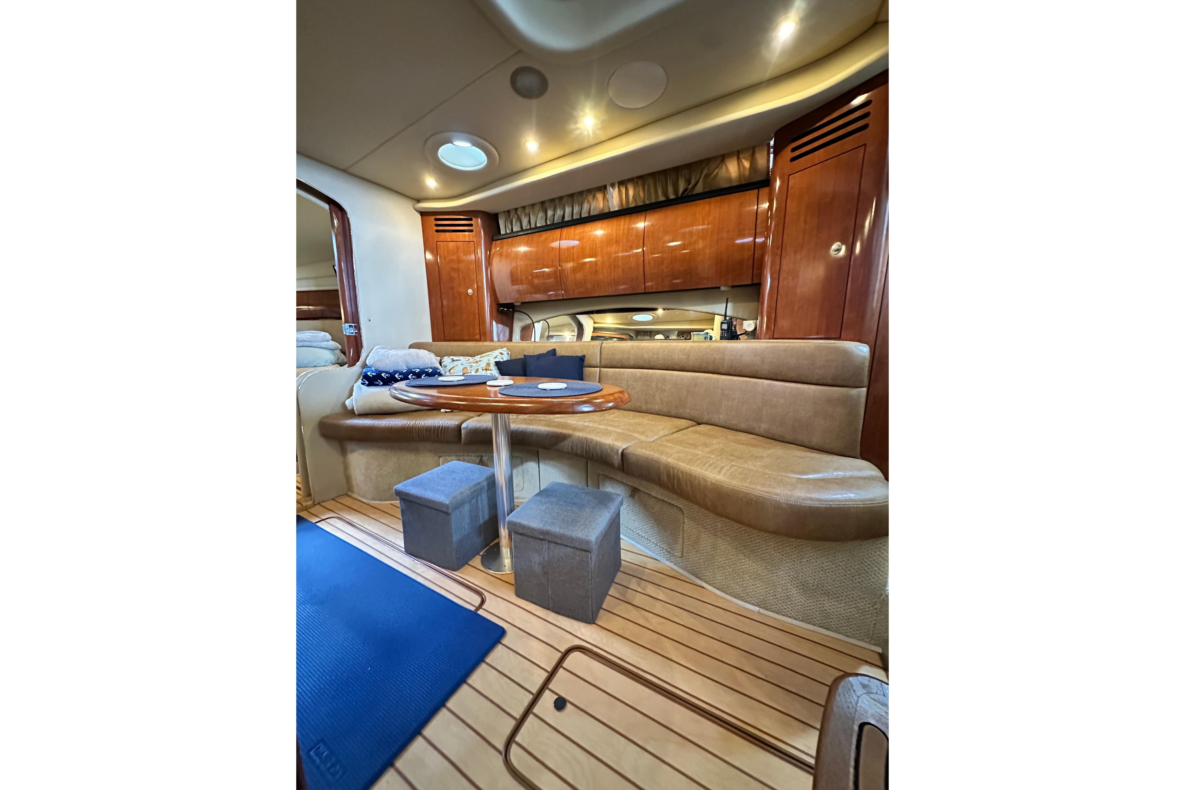Luxurious interior of 2005 Sea Ray 360 Sundancer yacht with elegant seating and wooden finishes.
