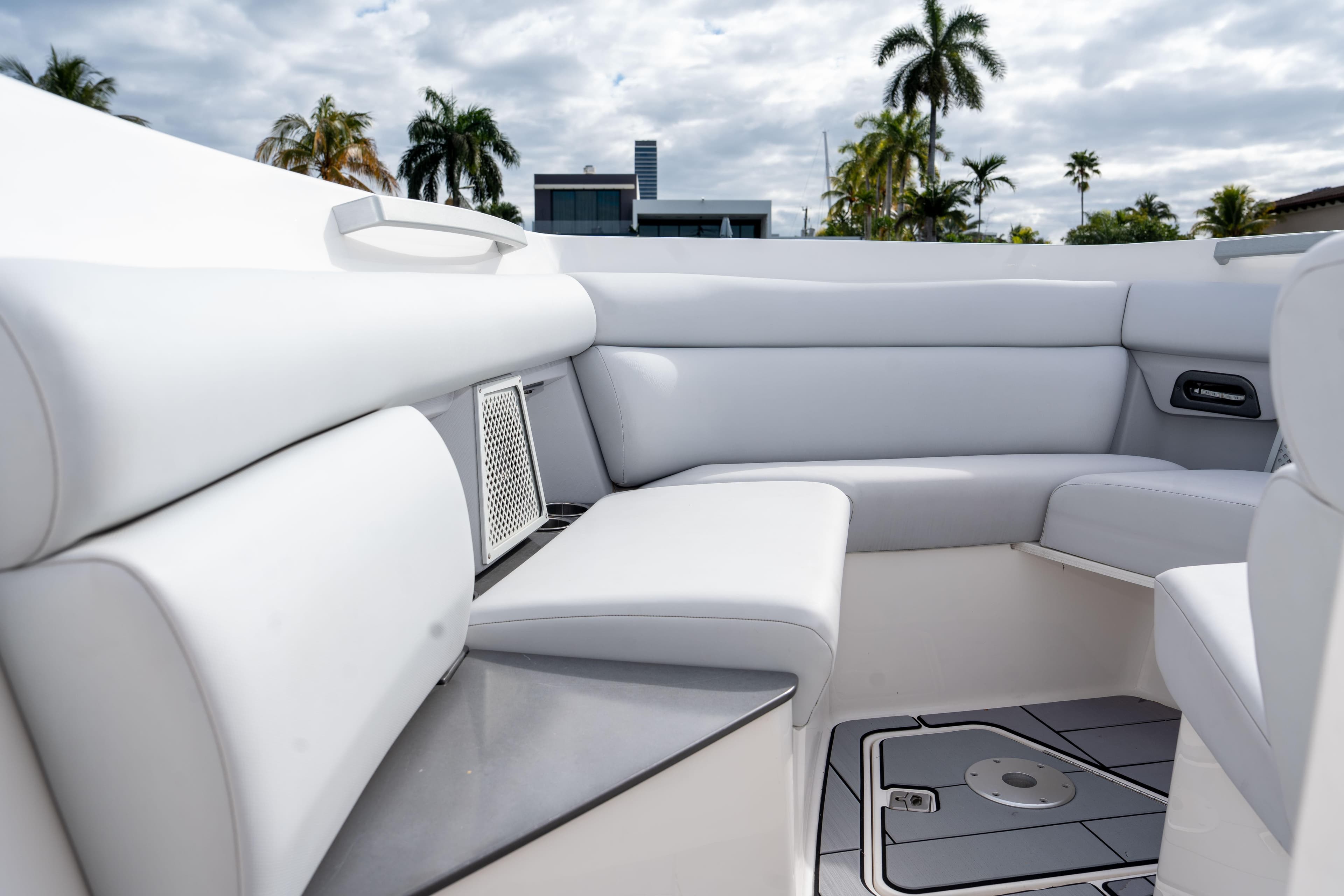 2022 Aviara AV32 OB boat interior with luxurious white seating and modern design.