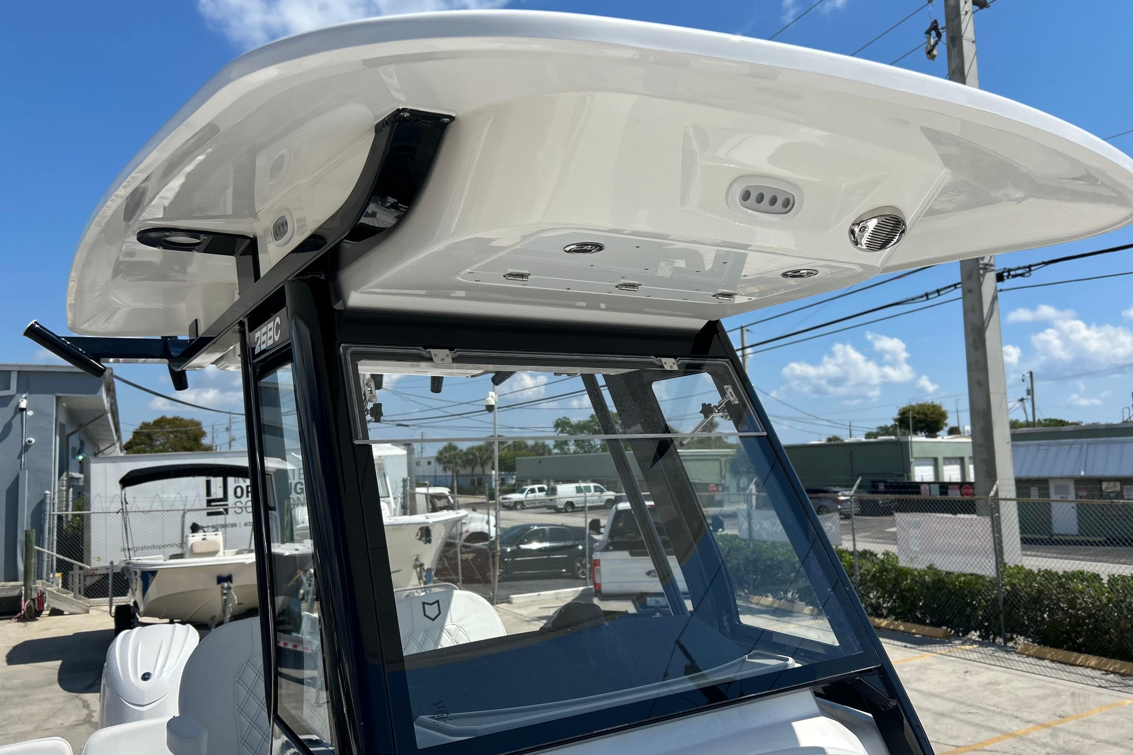 2026 Sea Fox 268 Commander boat console with T-top and clear windshield.