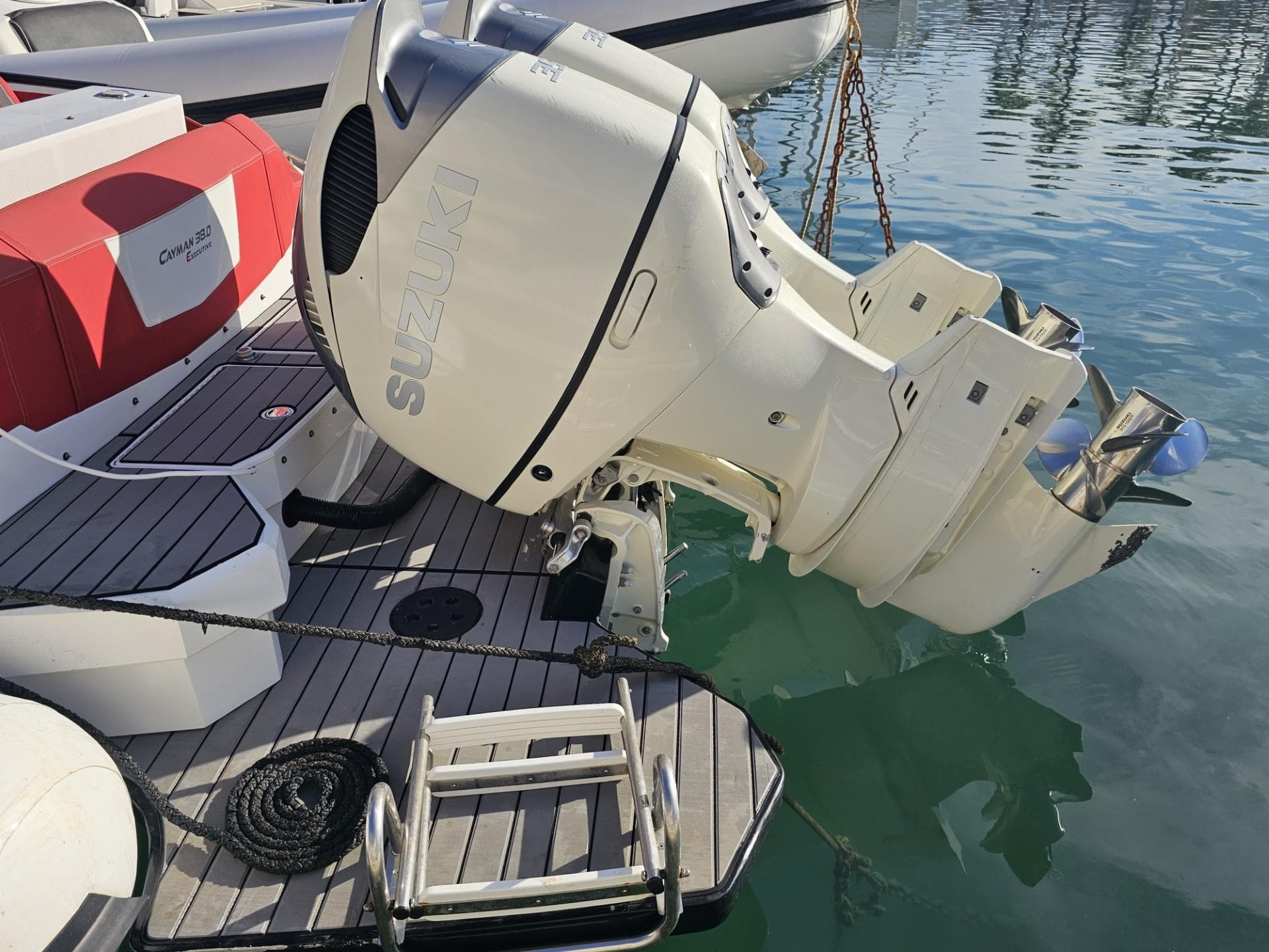 Ranieri CAYMAN 38.0 EXECUTIVE 2019 with Suzuki outboard motor in water.