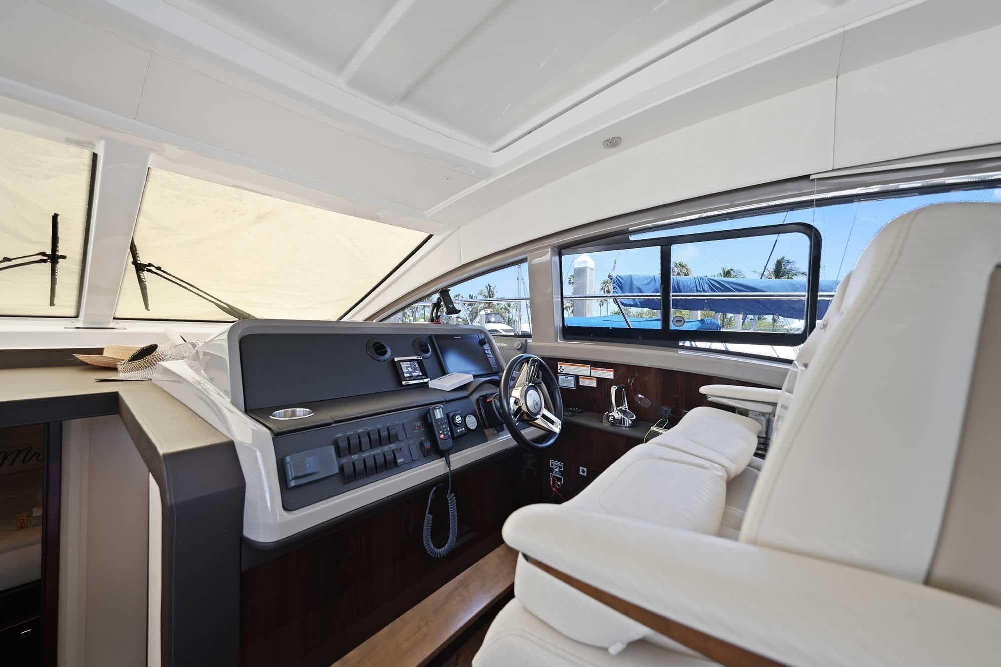 Interior helm of 2017 Sea Ray Sundancer 400 yacht with modern controls and seating.