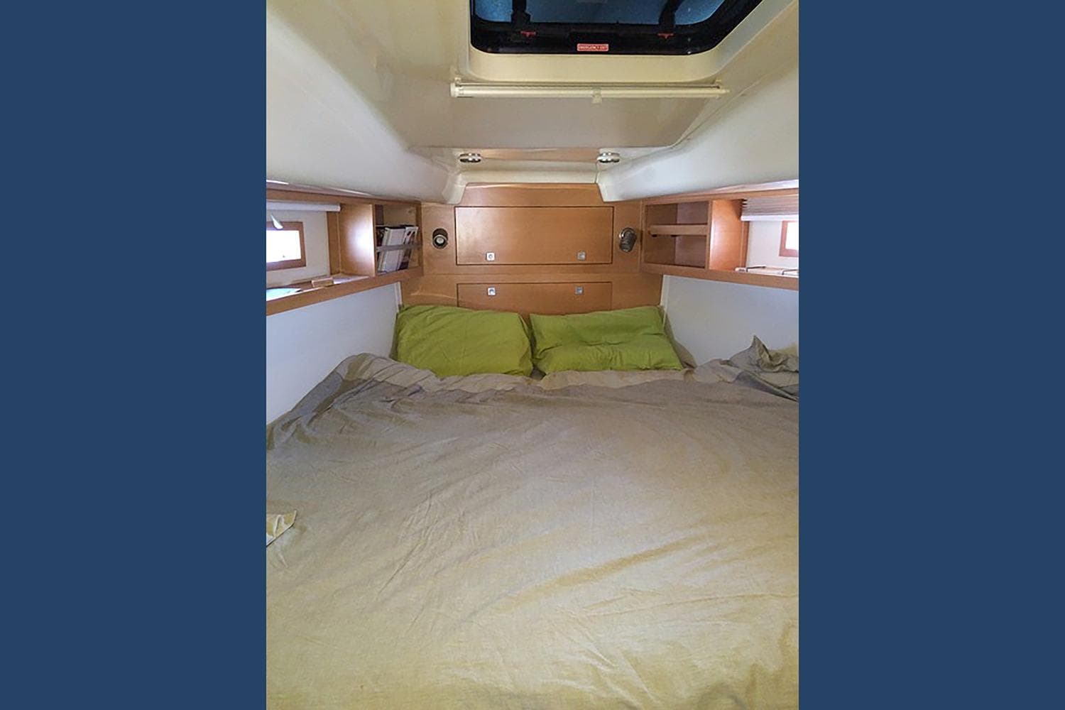 Cozy cabin interior of 2008 Elan Marine ELAN 450 yacht with bed and storage.