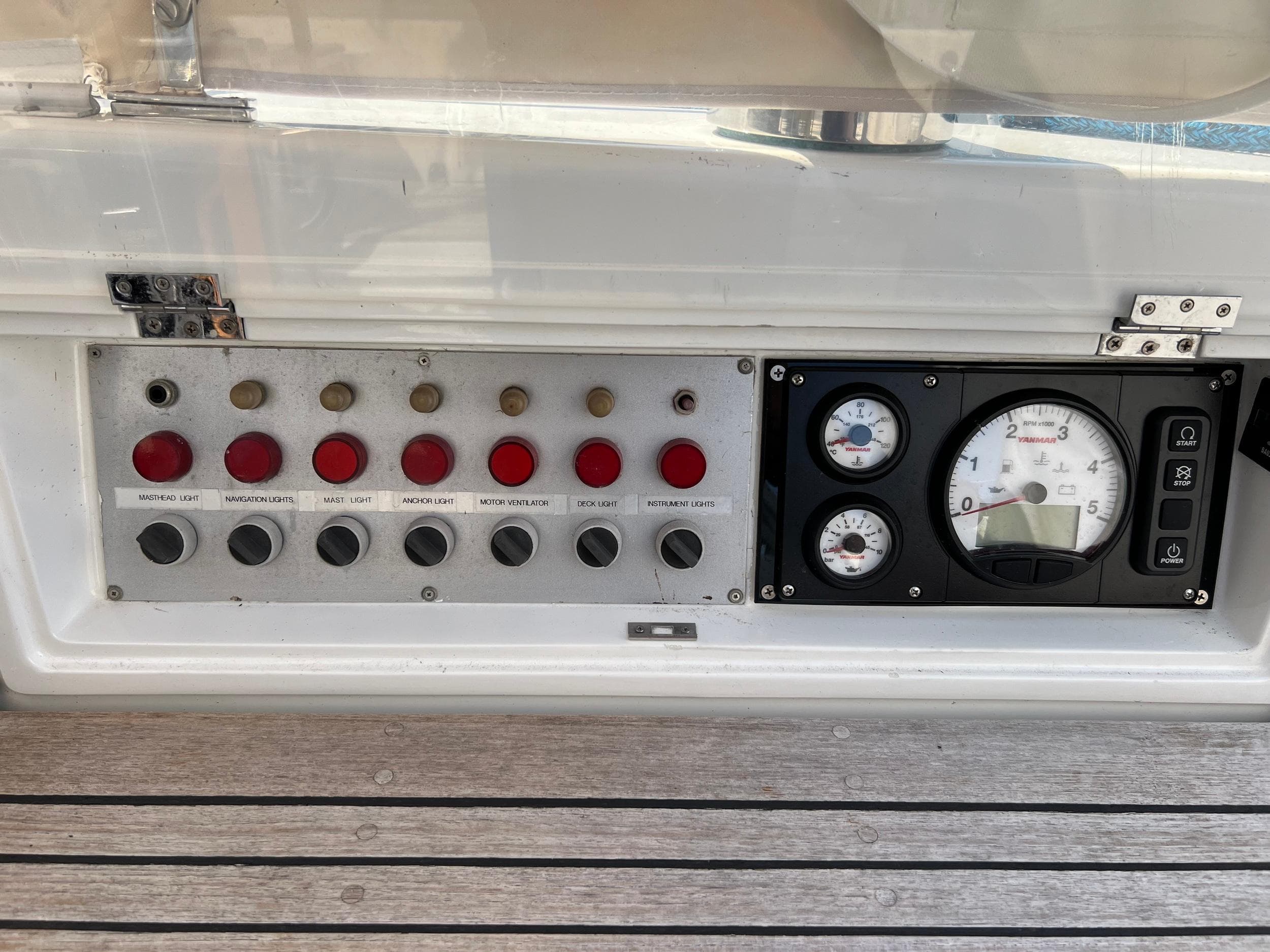 Control panel of a 1986 Jonmeri 40 yacht with gauges and switches.