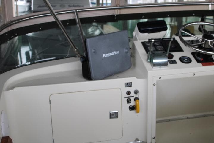 1988 Tollycraft 30 Sport Cruiser helm with Raymarine navigation system.