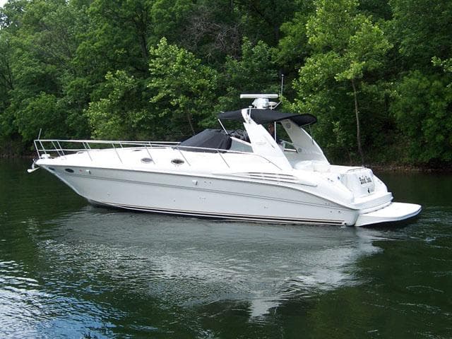 1999 Sea Ray Sundancer 400 on a calm river.