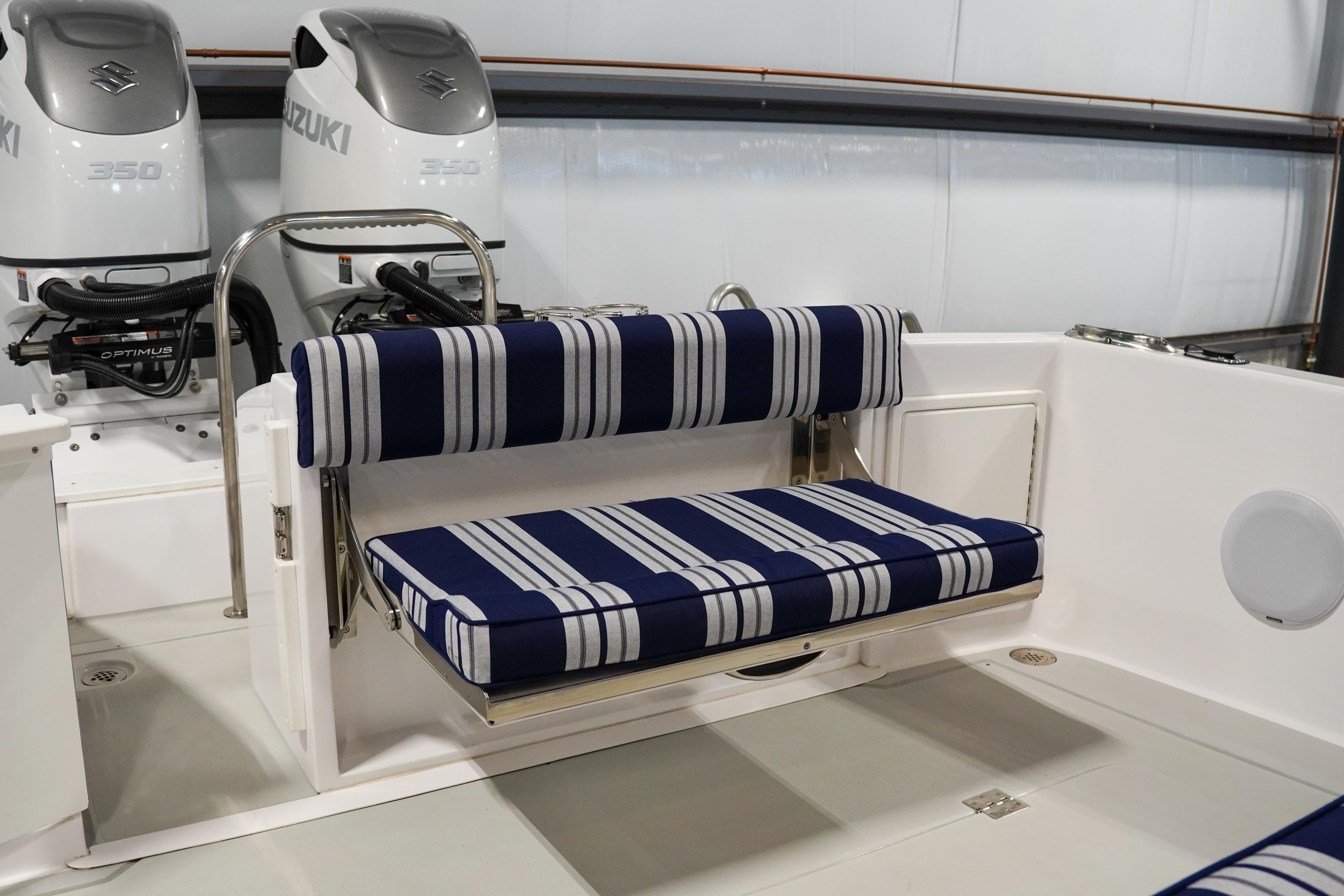 2024 True North 34 boat interior with striped seating and dual Suzuki engines.