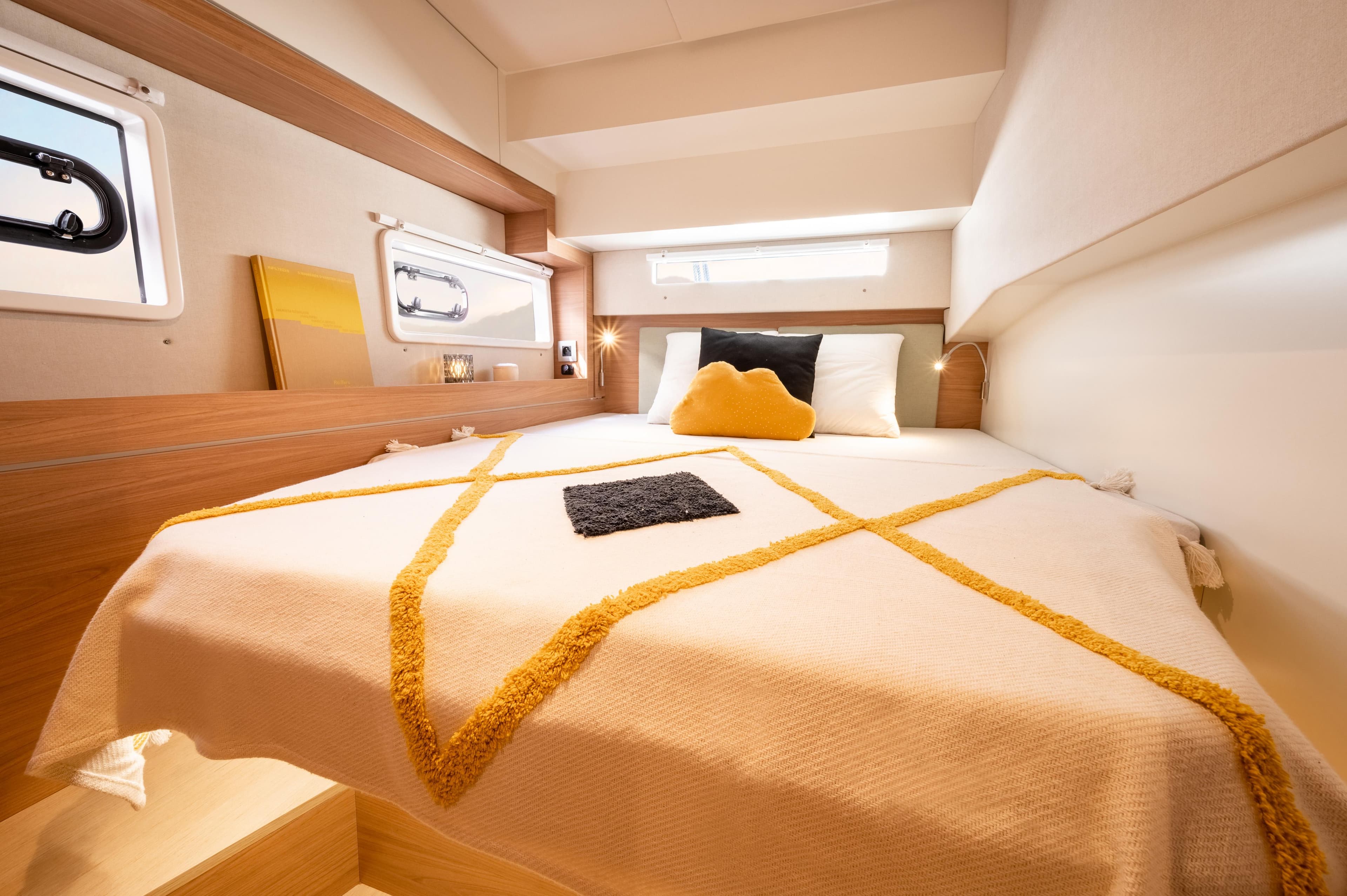 Cozy cabin interior of 2026 Bali 4.2 yacht with stylish bedding and modern design.