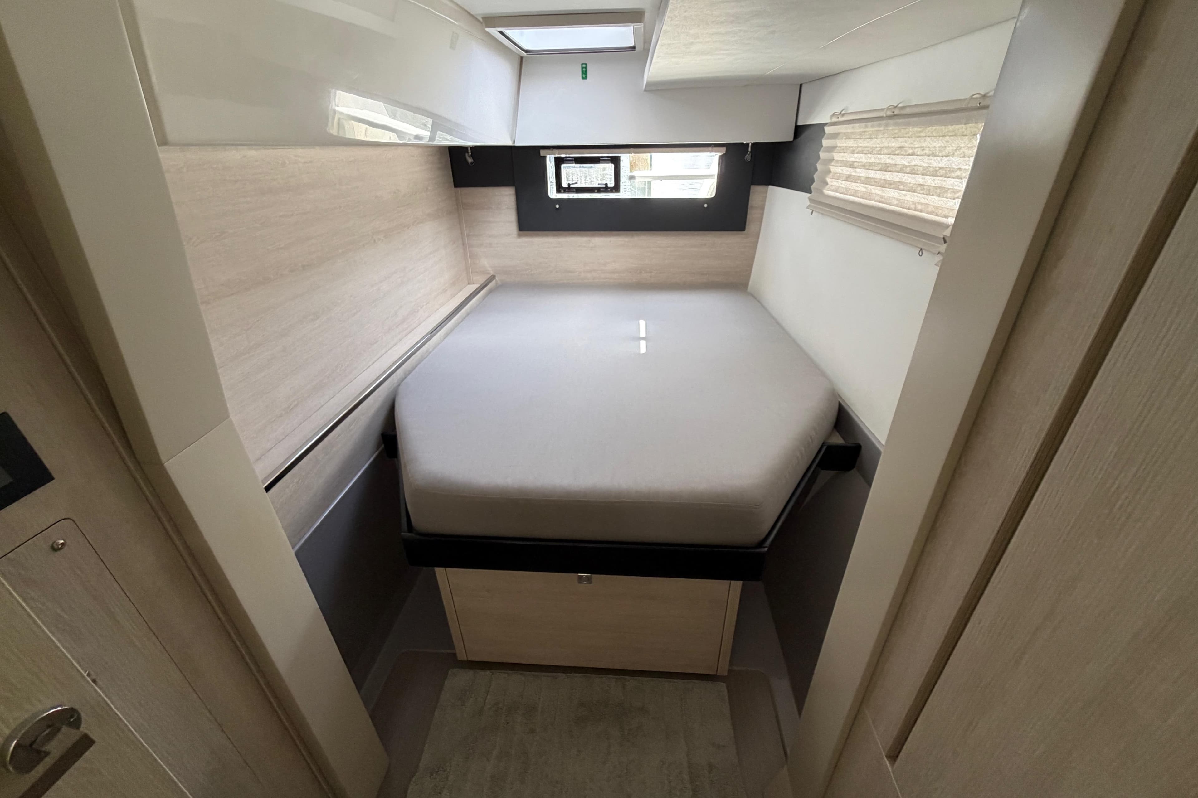 2020 Leopard 40 yacht cabin with a cozy bed and modern interior design.