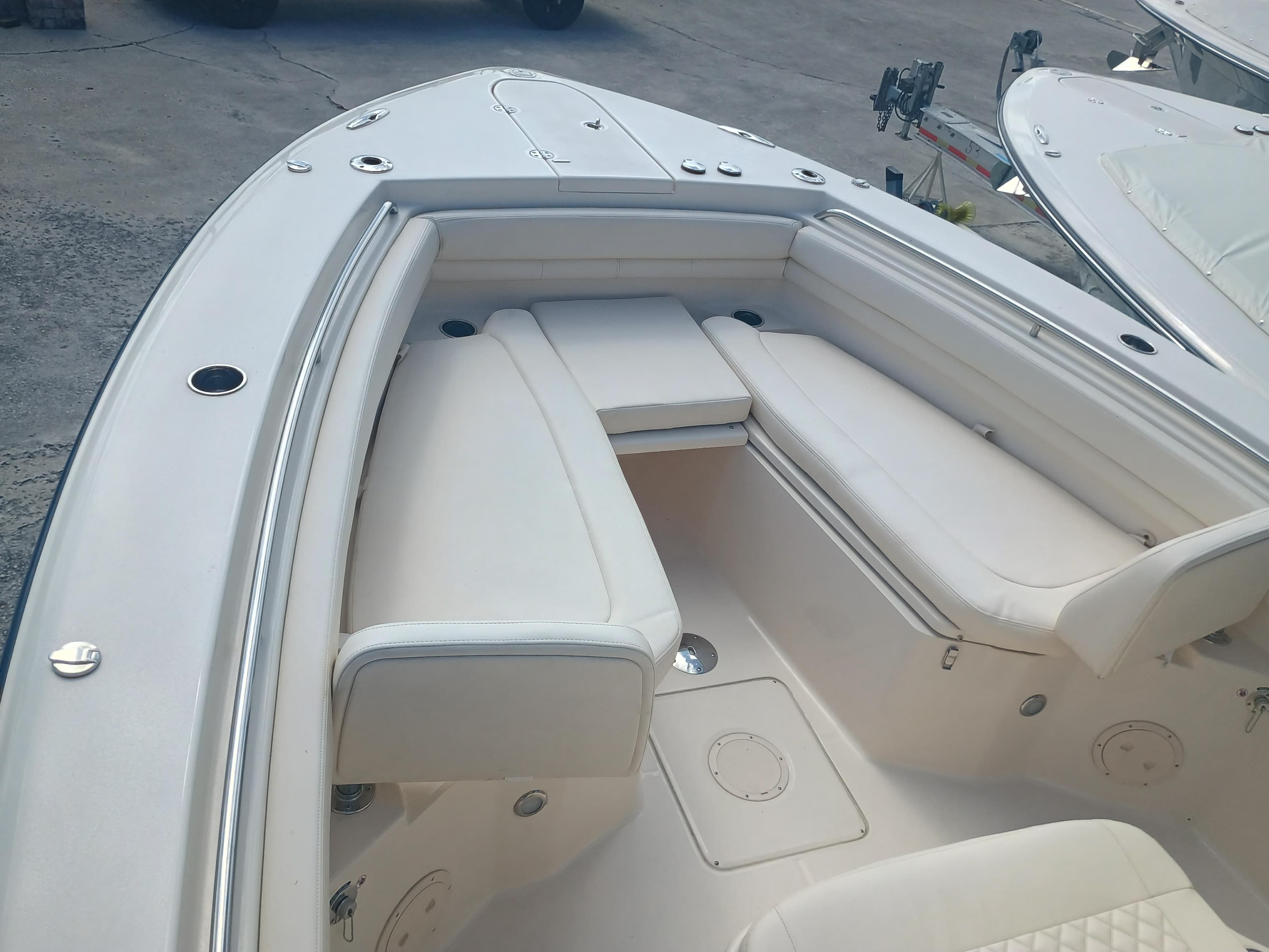 2025 Grady-White Canyon 306 boat interior with cushioned seating and sleek design.