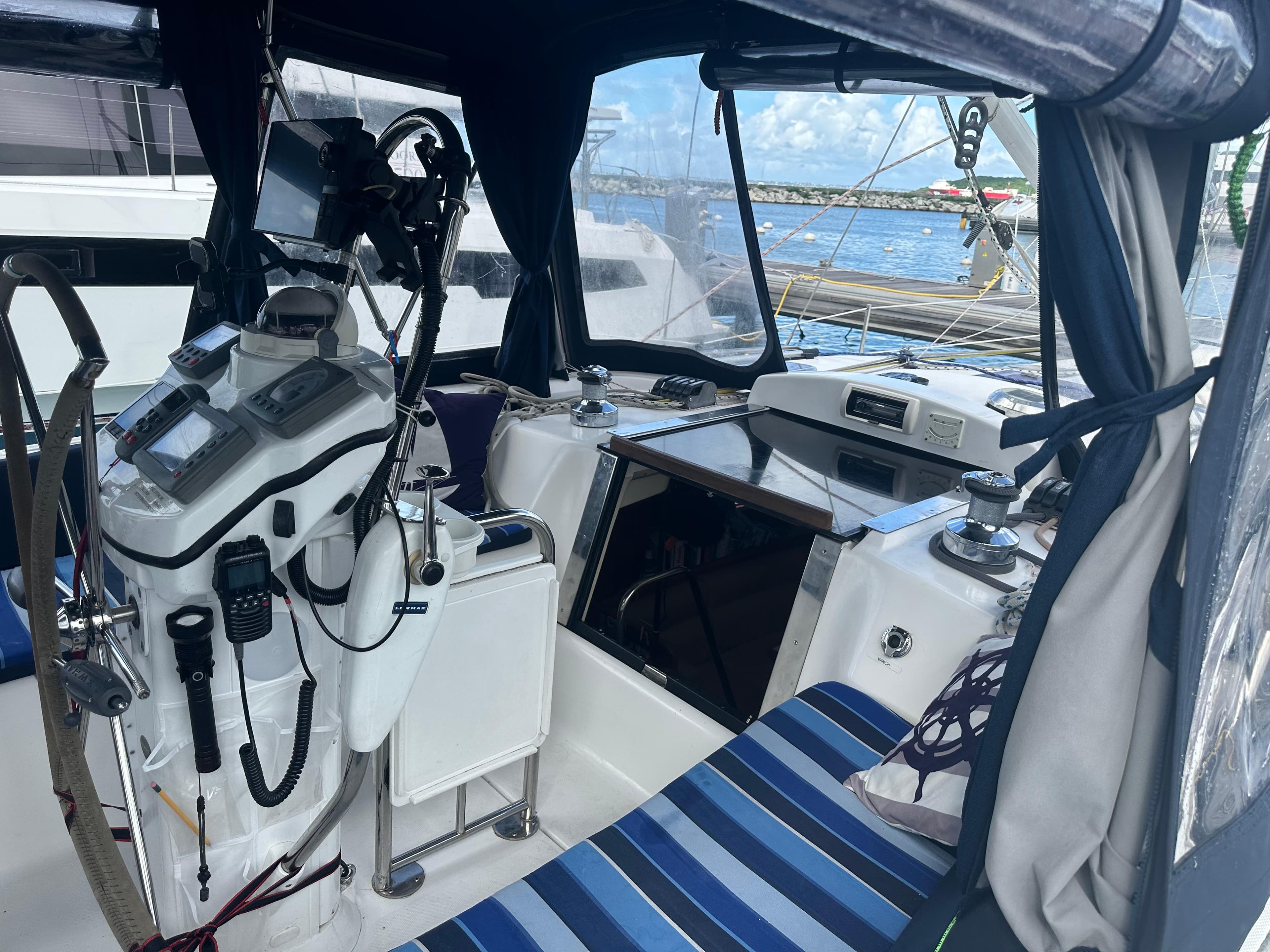 Interior view of a 2006 Hunter 45cc sailboat cockpit with navigation equipment.