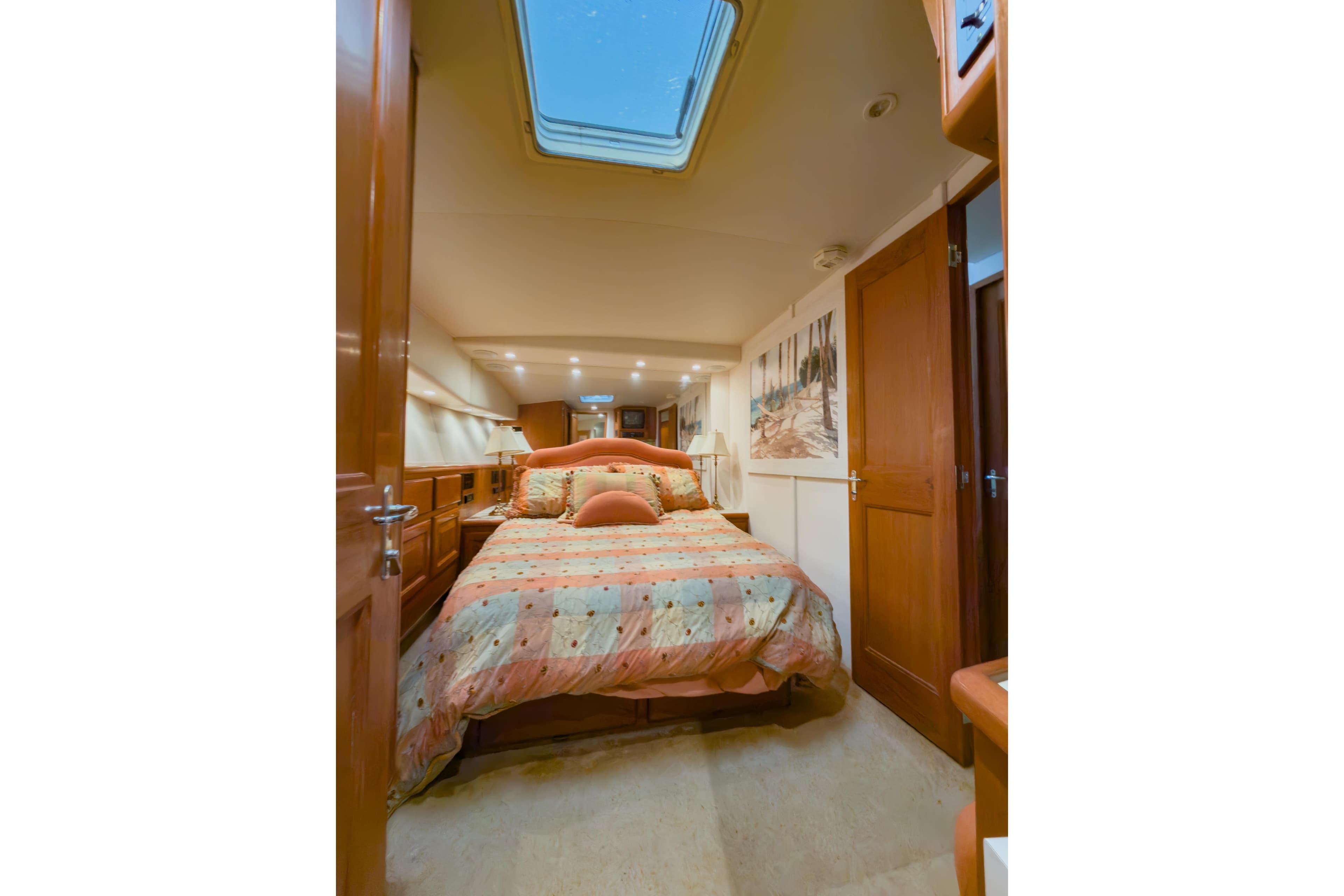 Luxurious bedroom interior of 1996 Viking 50 Sport Fisher Convertible yacht.