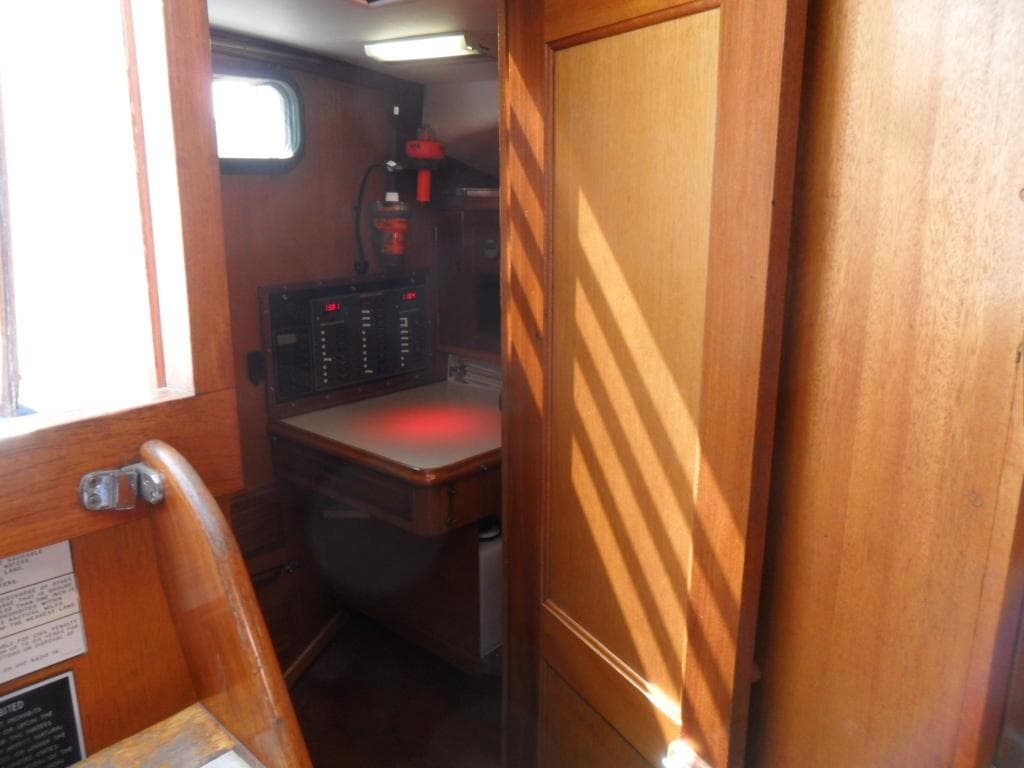 Interior of a 1976 Ericson 36C yacht with wooden furnishings.