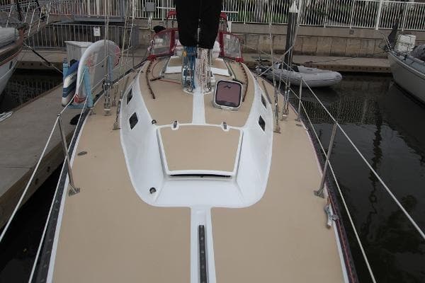 1979 Catalina 38 sailboat docked, showcasing deck and cabin details.
