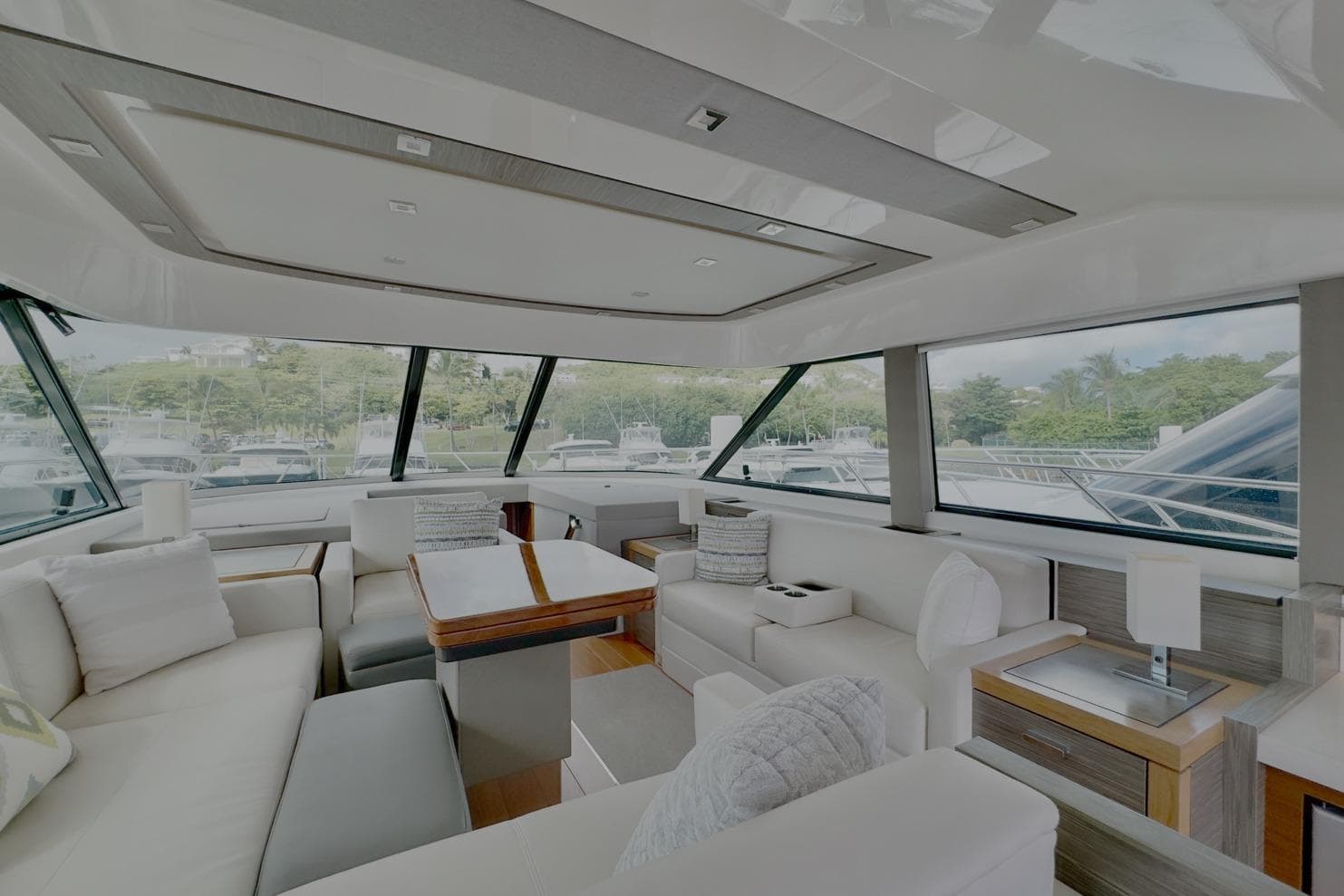 Luxurious interior of 2020 Tiara Yachts F53 Flybridge with elegant seating and panoramic windows.