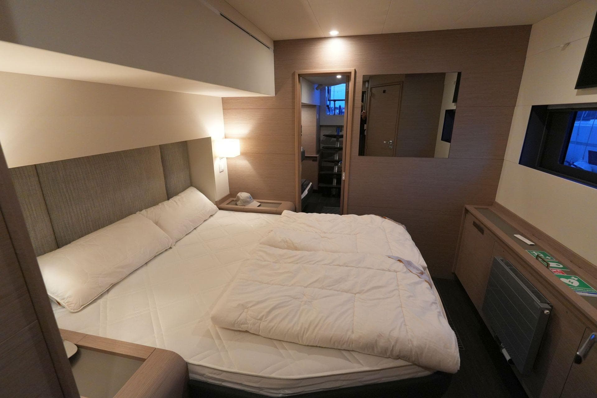 Luxurious bedroom interior of 2022 Fountaine Pajot Alegria 67 yacht, featuring modern design.