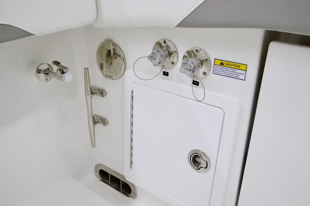 2026 Regulator 31 boat control panel with caution label and fittings.