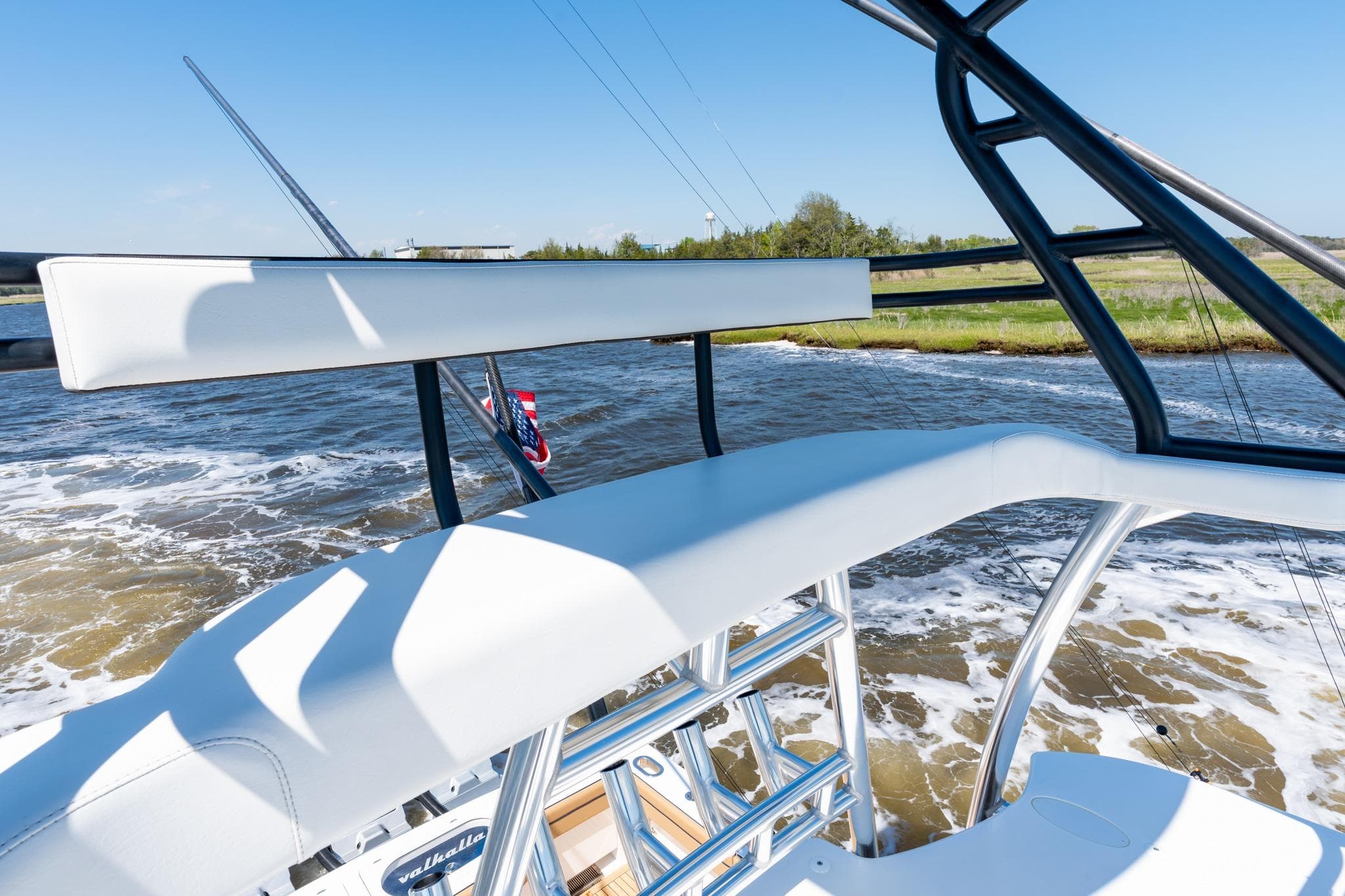 2023 Valhalla Boatworks V-46 cruising on a sunny day, showcasing sleek design and craftsmanship.