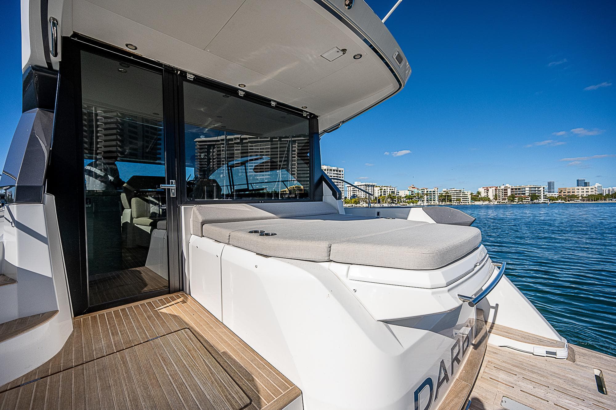 2022 Beneteau Gran Turismo 45 yacht with sun deck and waterfront view.