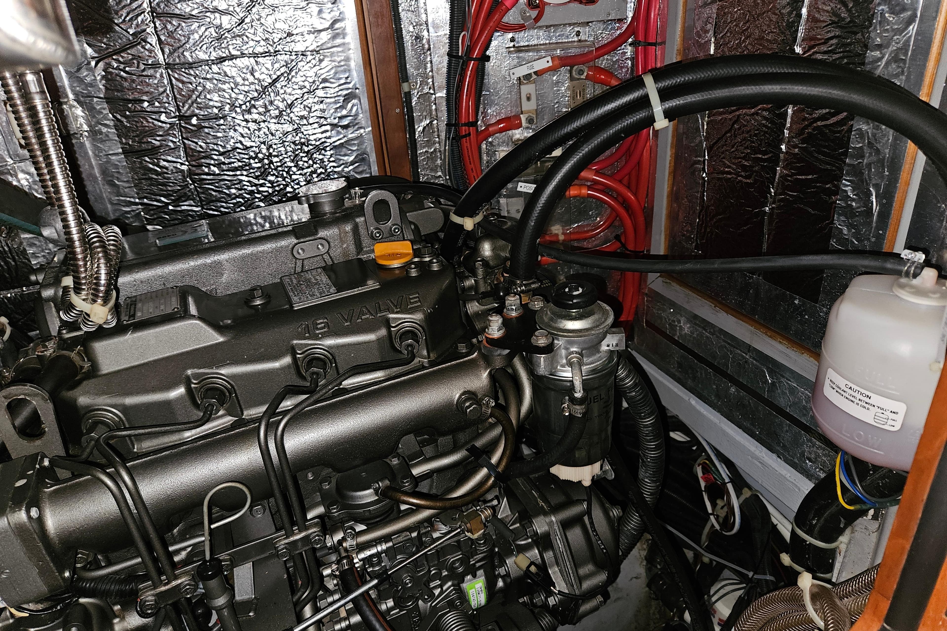 Engine compartment of a 2013 Passport 470 Center Cockpit sailboat, showing detailed components.