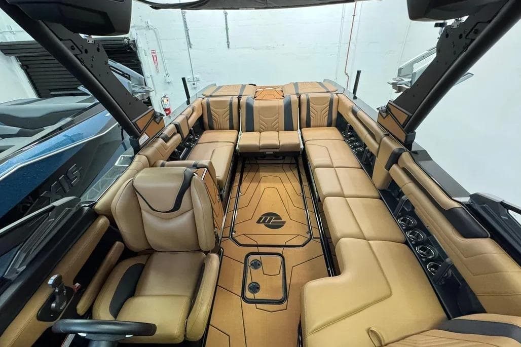Luxurious interior of 2026 Malibu Wakesetter 25 LSV boat with tan leather seating.