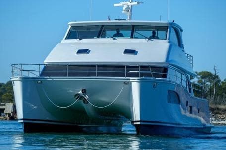 2022 Horizon PC65 yacht on water, showcasing sleek design and modern features.