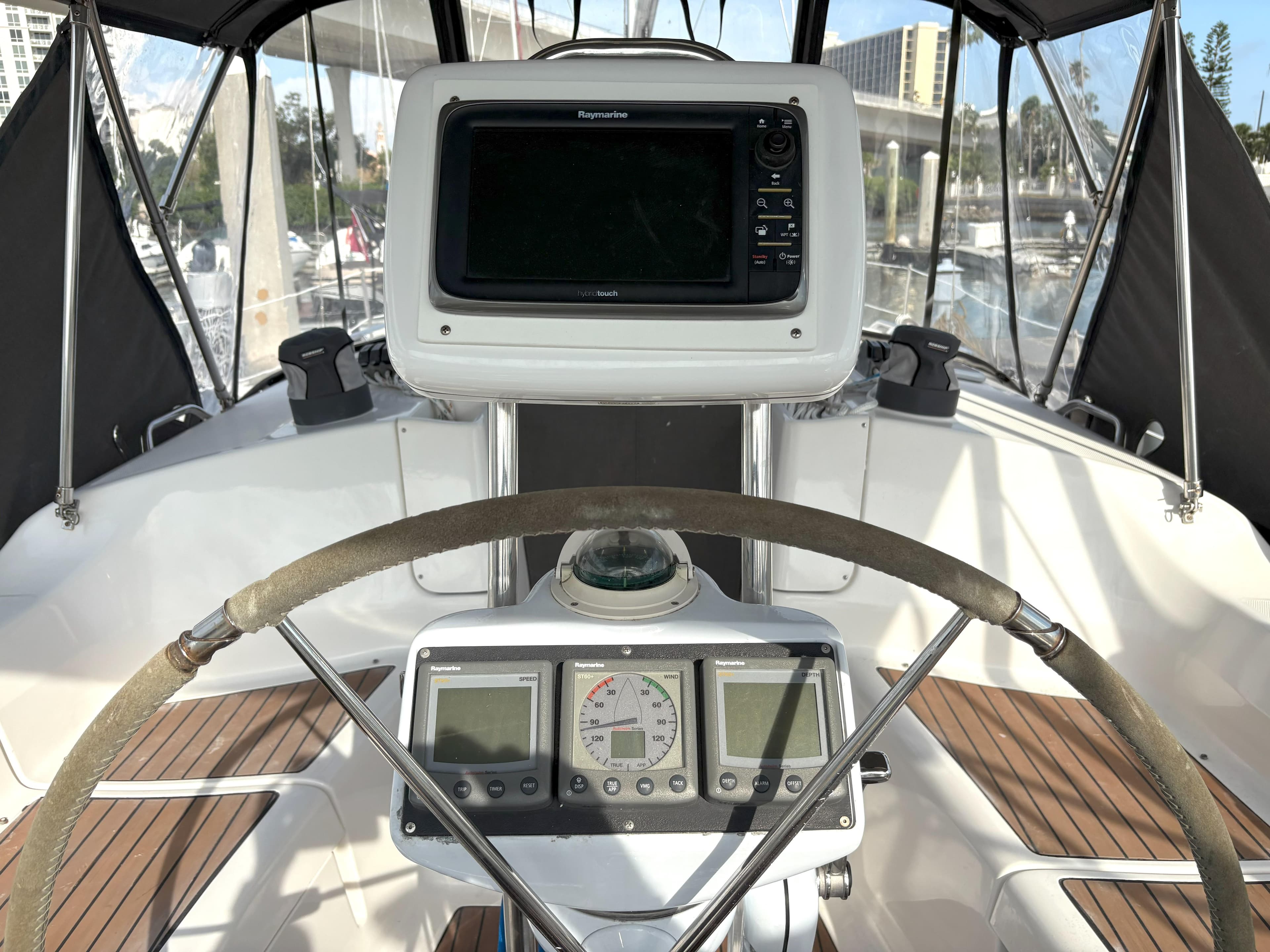2005 Hunter 38 sailboat cockpit with navigation equipment and steering wheel.