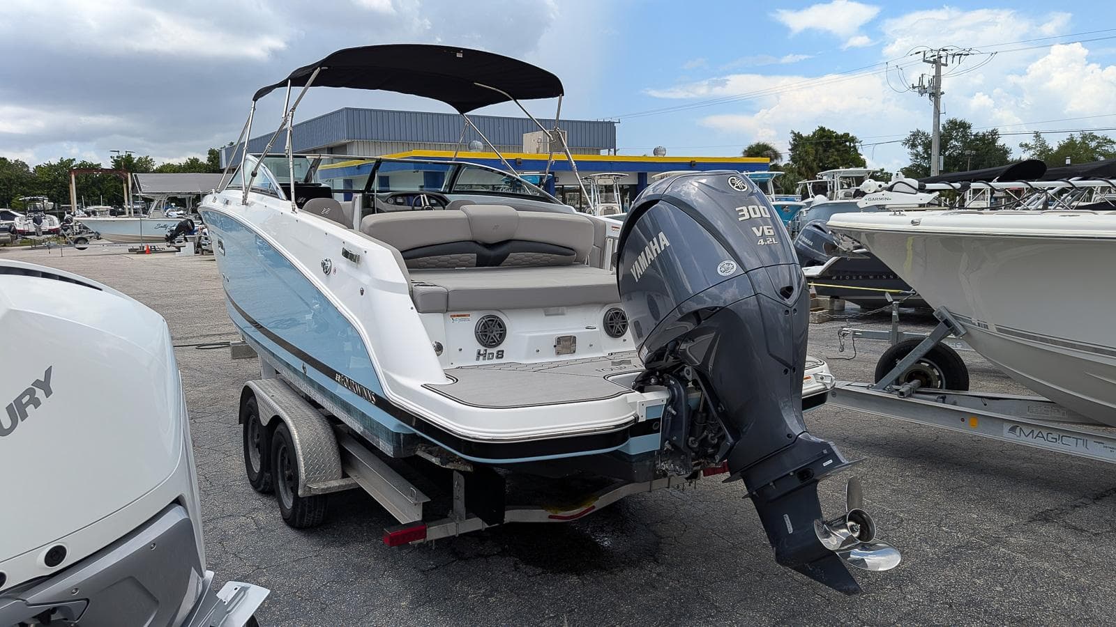 2024 Four Winns HD8 OB boat with Yamaha 300 V6 engine on trailer.