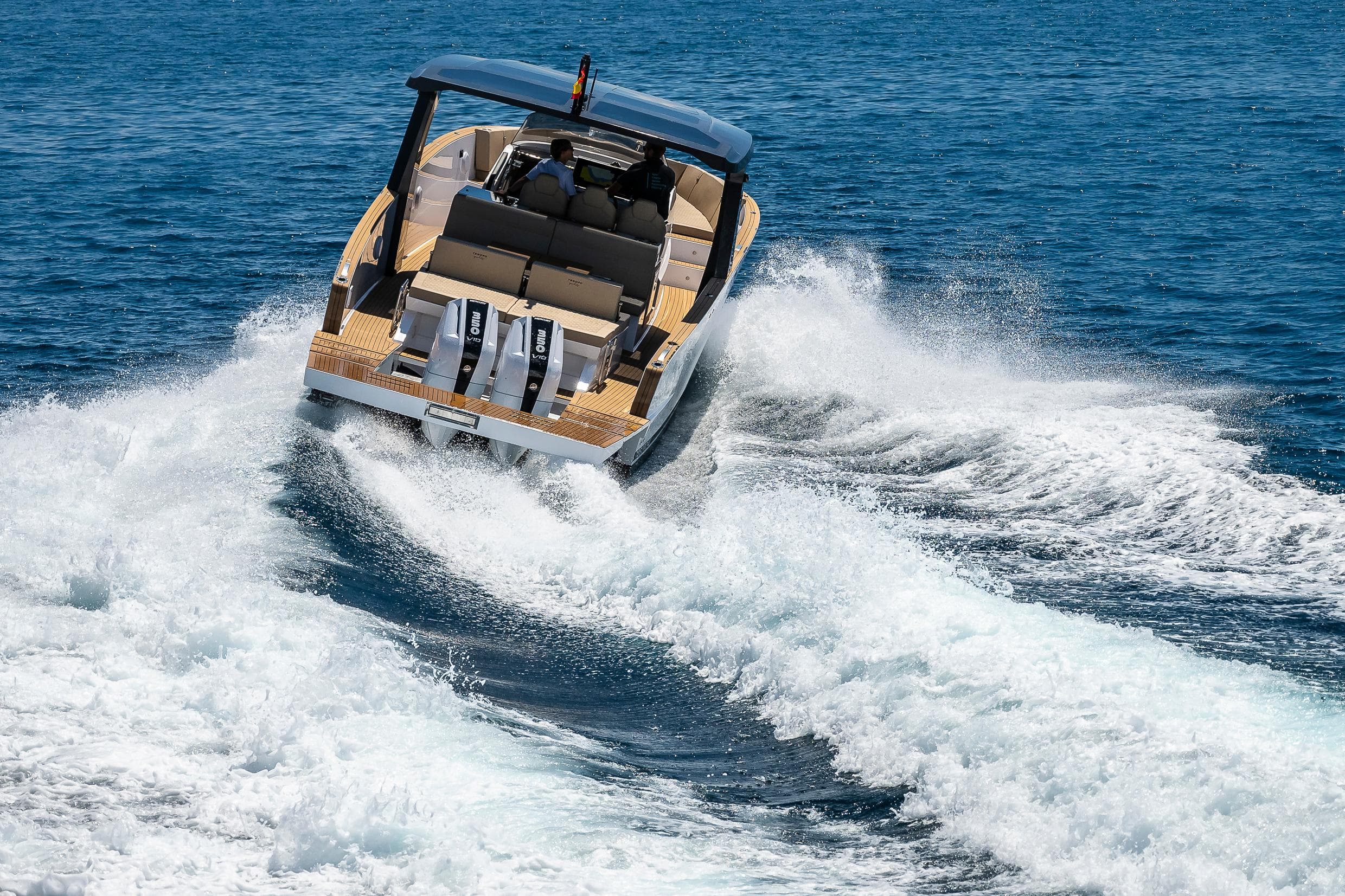 2025 Tesoro T40 Outboard boat cruising on open water, creating dynamic waves.