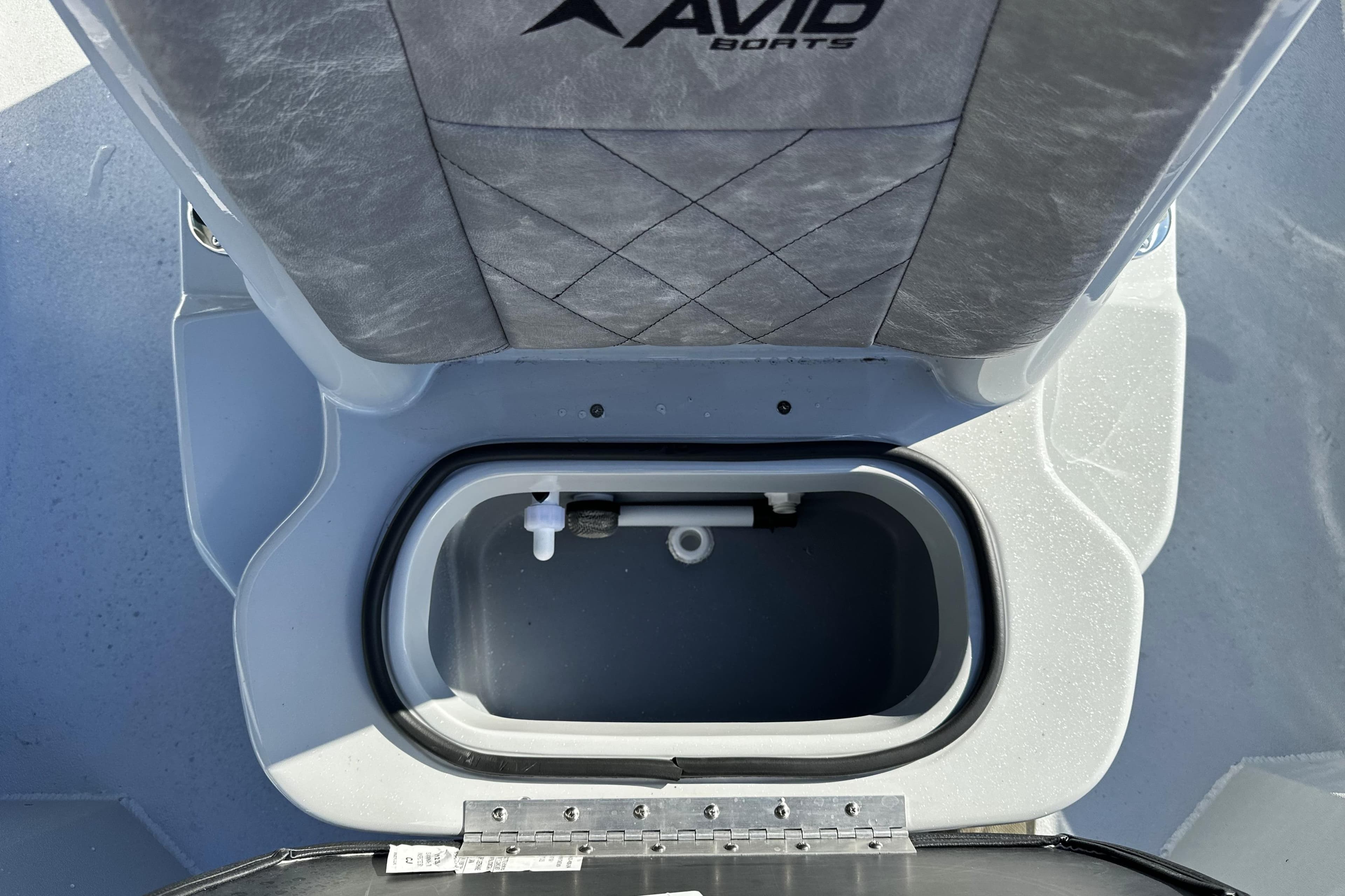Avid 21 FSX 2026 boat seat with integrated storage compartment.