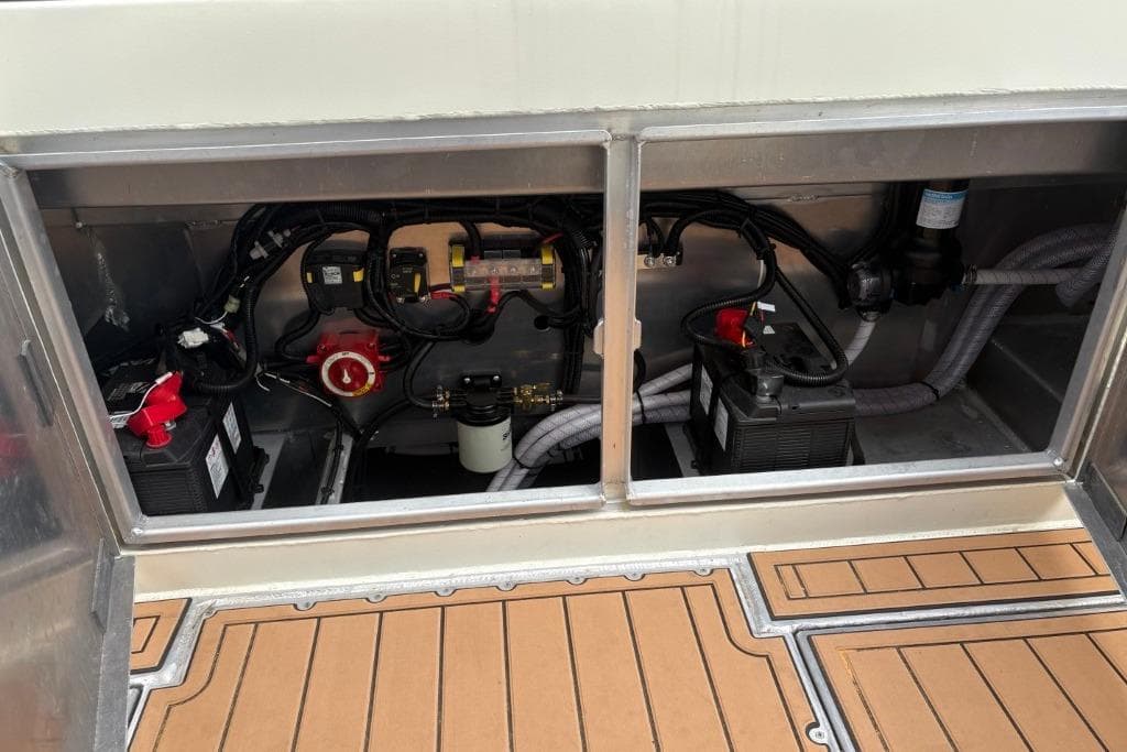 2025 Ortun Express Cruiser engine compartment with batteries and wiring.