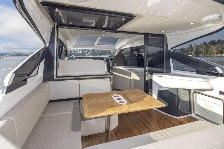 Interior of 2021 Fairline Targa 45 GT yacht with modern seating and wooden table.