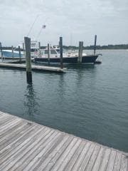 2001 Grand Banks 49 Eastbay SX docked at a marina on a cloudy day.
