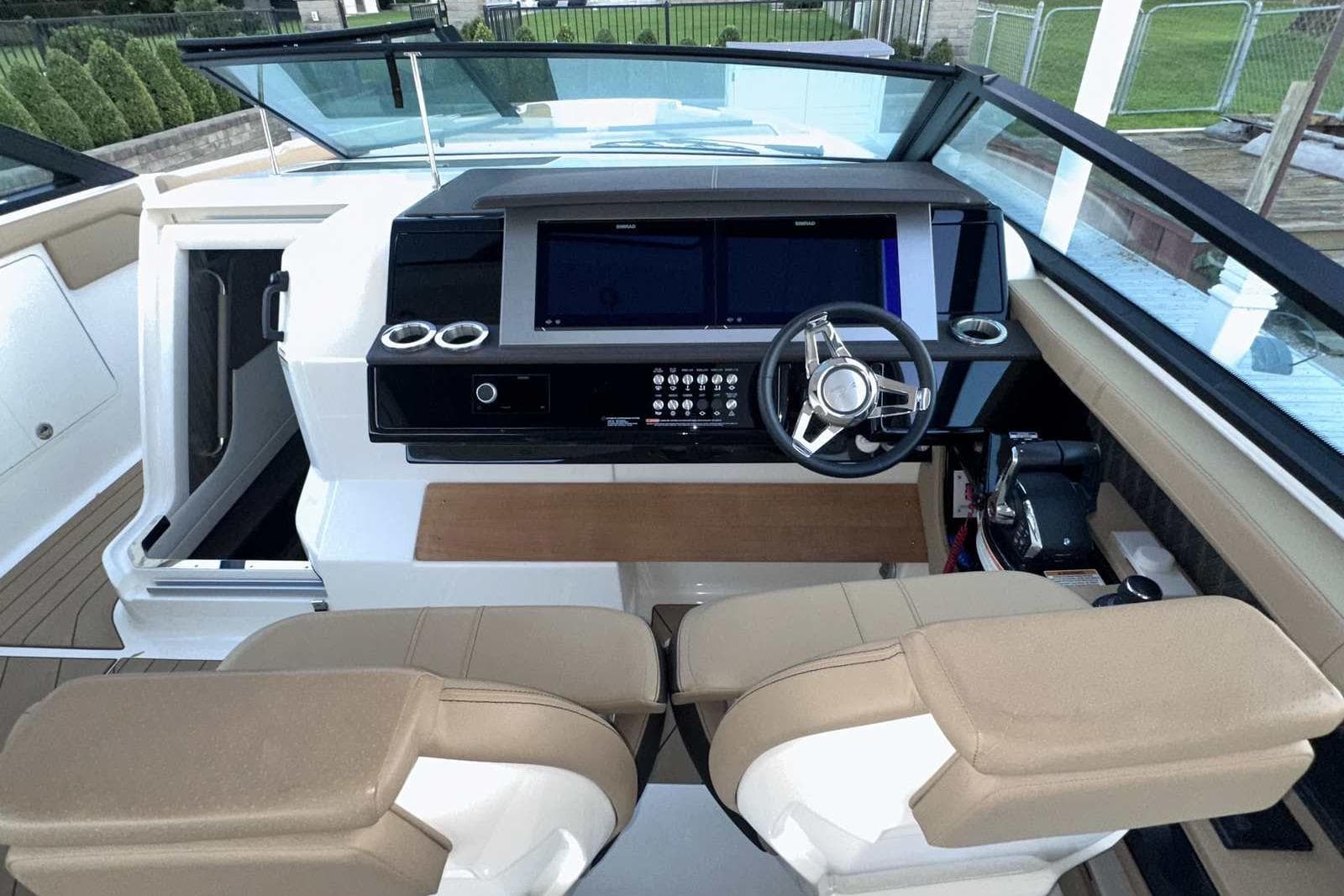 2024 Sea Ray SLX 400 helm with modern dashboard and dual seating.