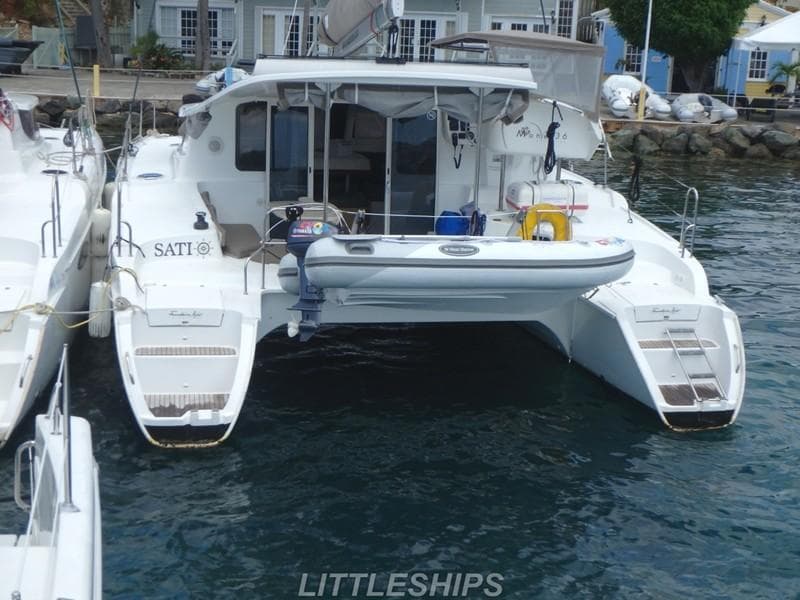 Fountaine Pajot MAHE EVO 2015 catamaran docked at harbor.