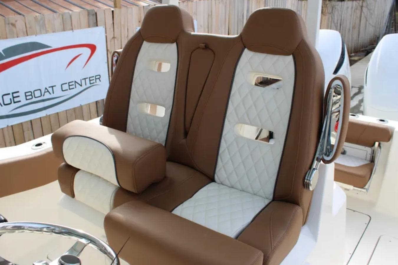 2026 Pioneer 270 Pelagic boat seats with brown and white quilted design.