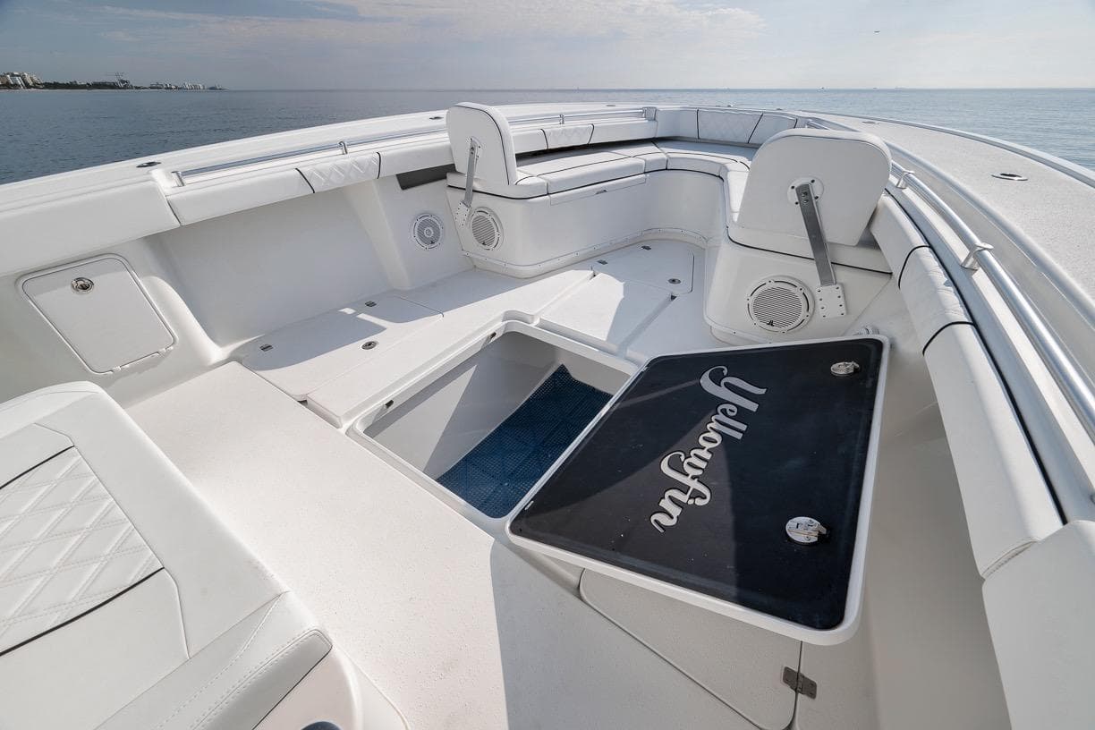 2012 Yellowfin 39 Offshore boat interior with spacious seating and storage, overlooking calm ocean waters.