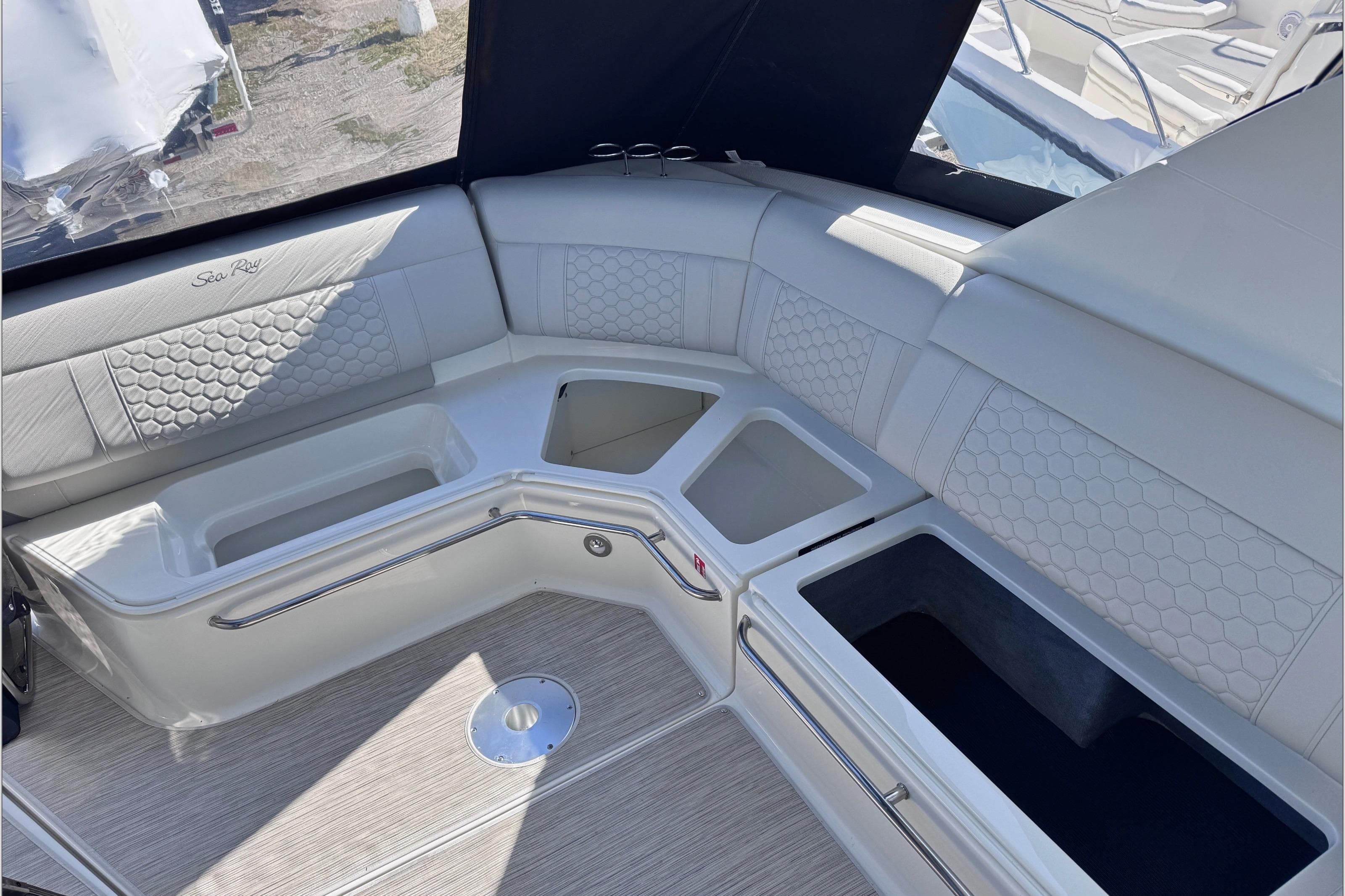 Luxurious seating area on 2025 Sea Ray Sundancer 320 yacht with elegant upholstery.
