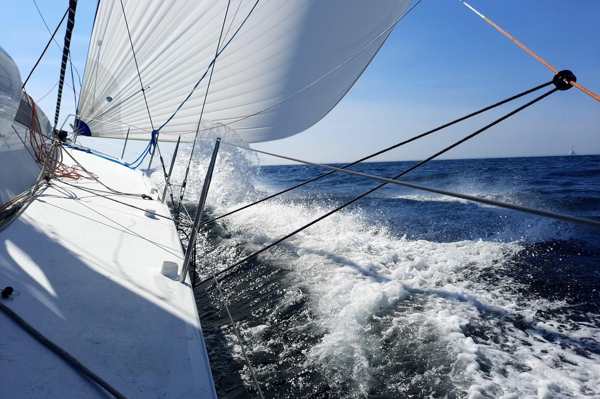 Sailing yacht Class 40 VPLP Clak 40, 2021, cutting through ocean waves.
