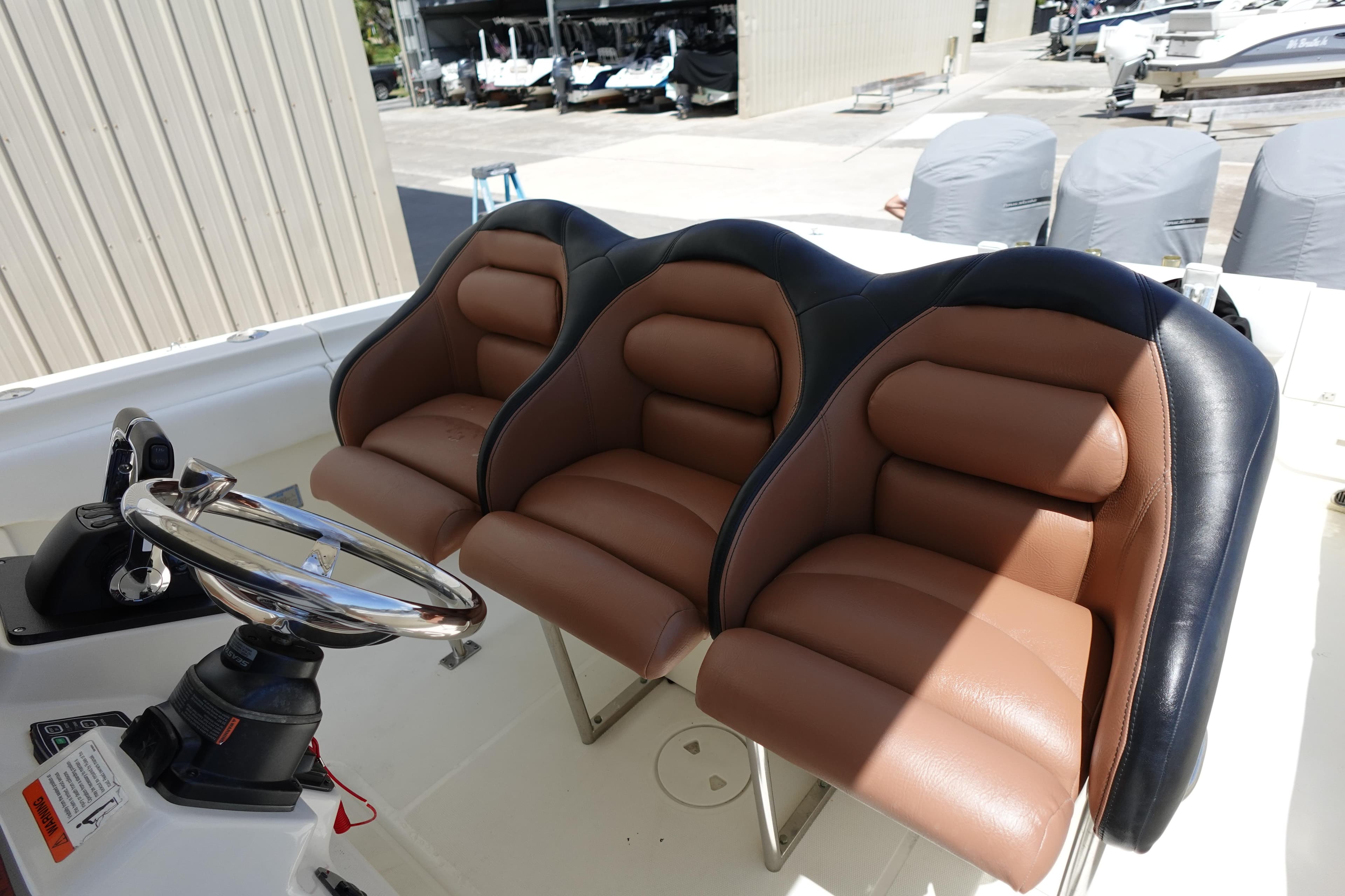 2005 Hydra-Sports Vector 3300 CC boat with three brown and black cushioned seats.